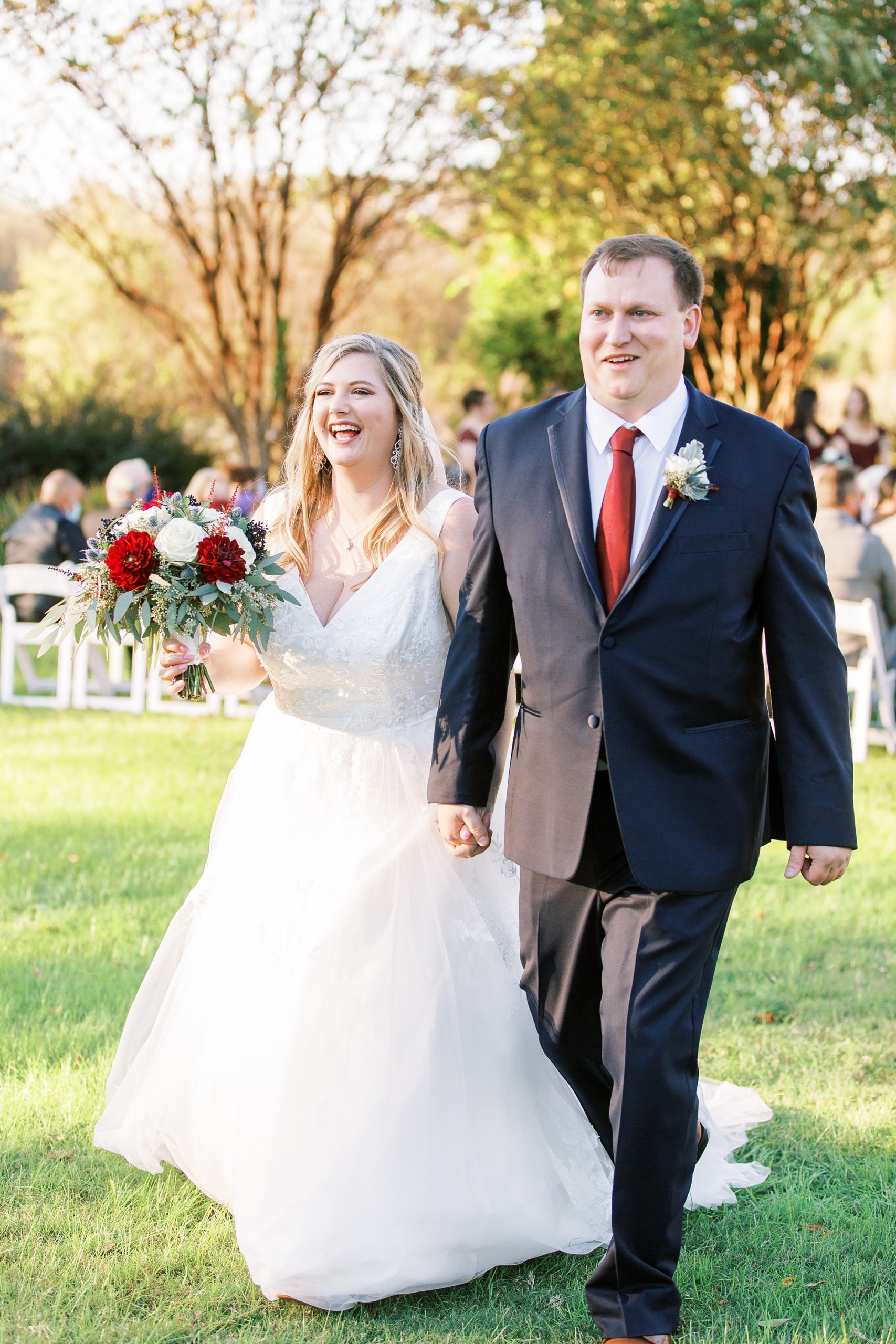 bride and groom walk up aisle after ceremony