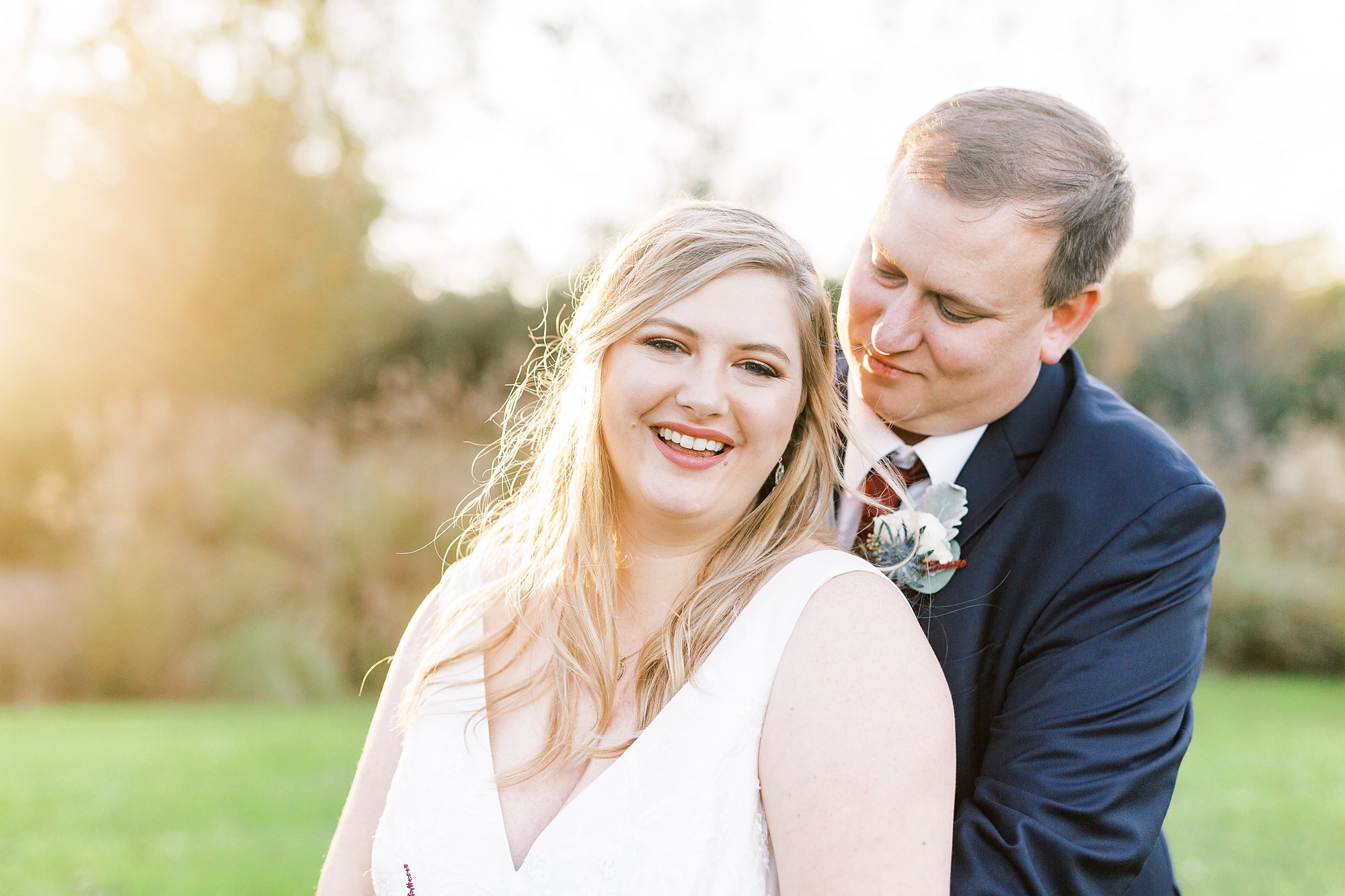 groom looks at bride from behind during NC photos