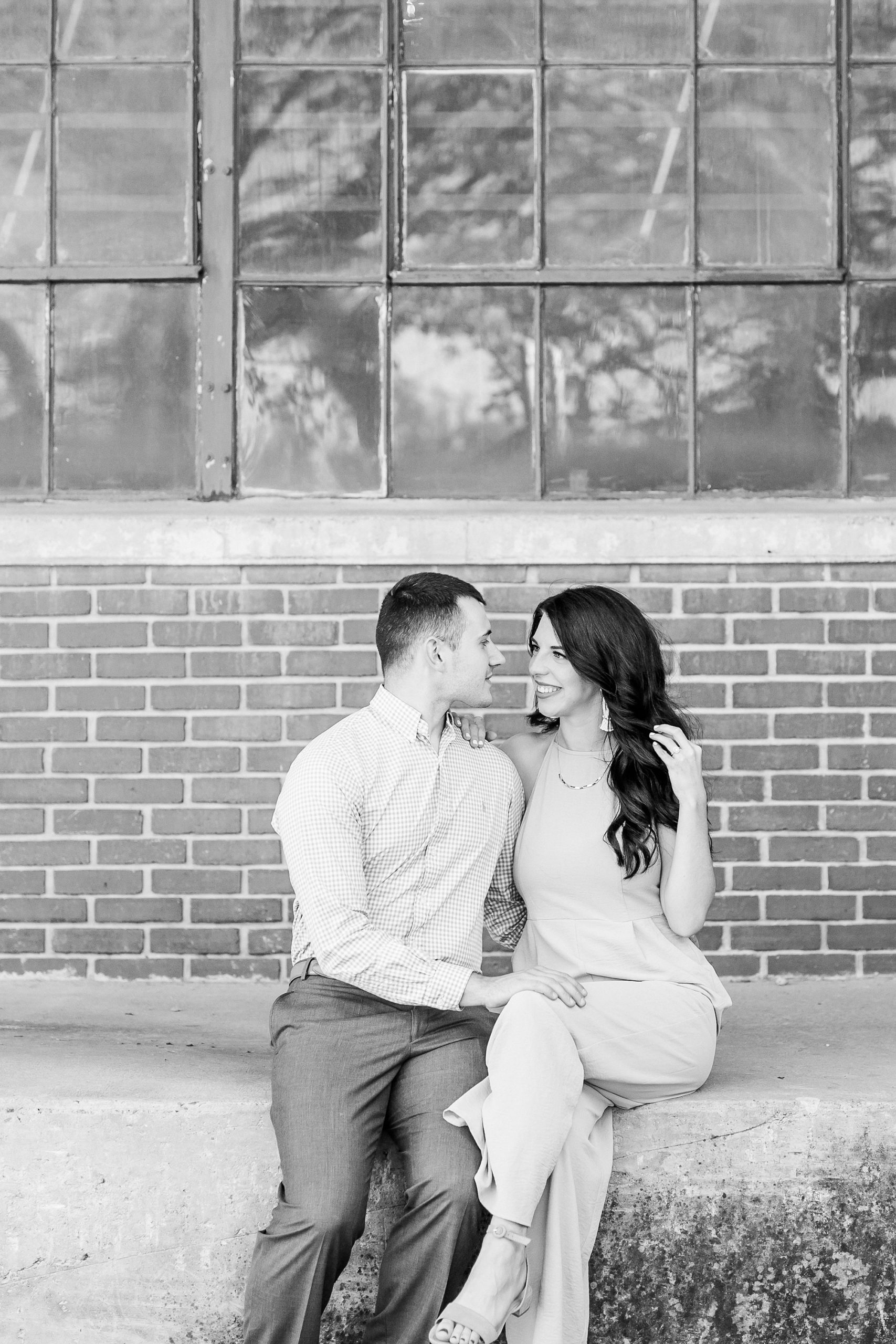 Camp North End engagement portraits on warehouse dock
