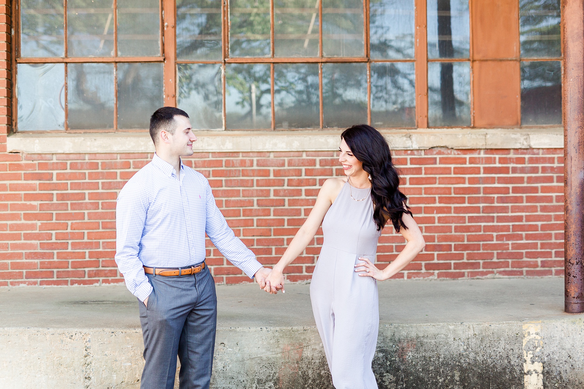 bride laughs while looking at groom