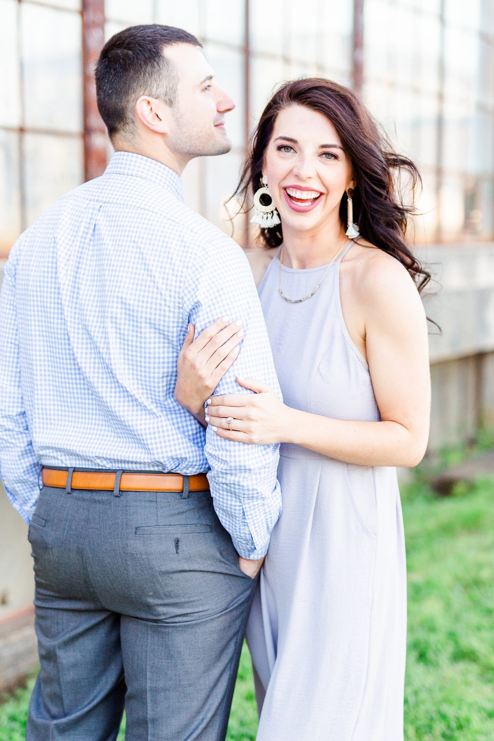 bride and groom laugh during Camp North End engagement session
