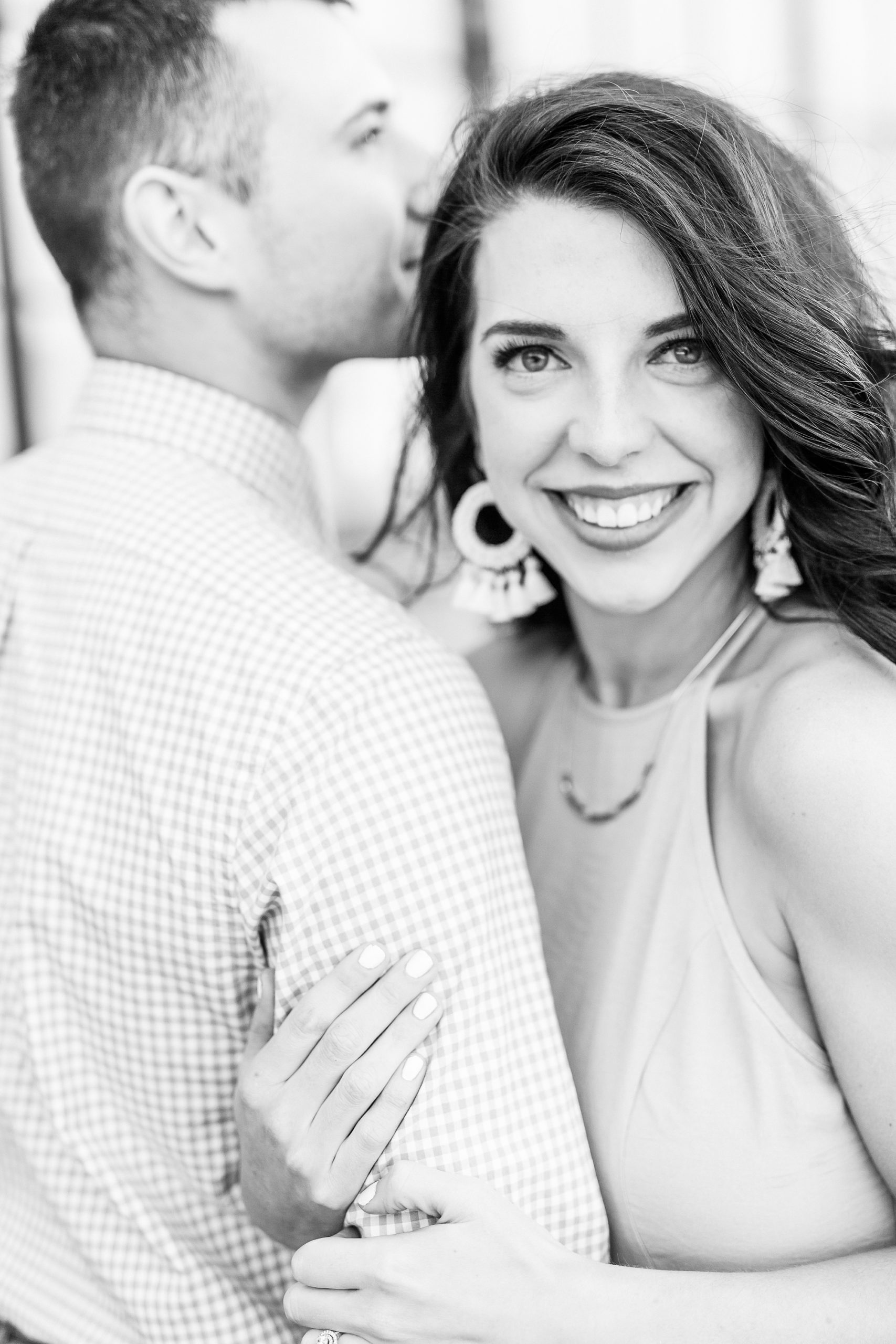 bride and groom snuggle close during Camp North End engagement photos