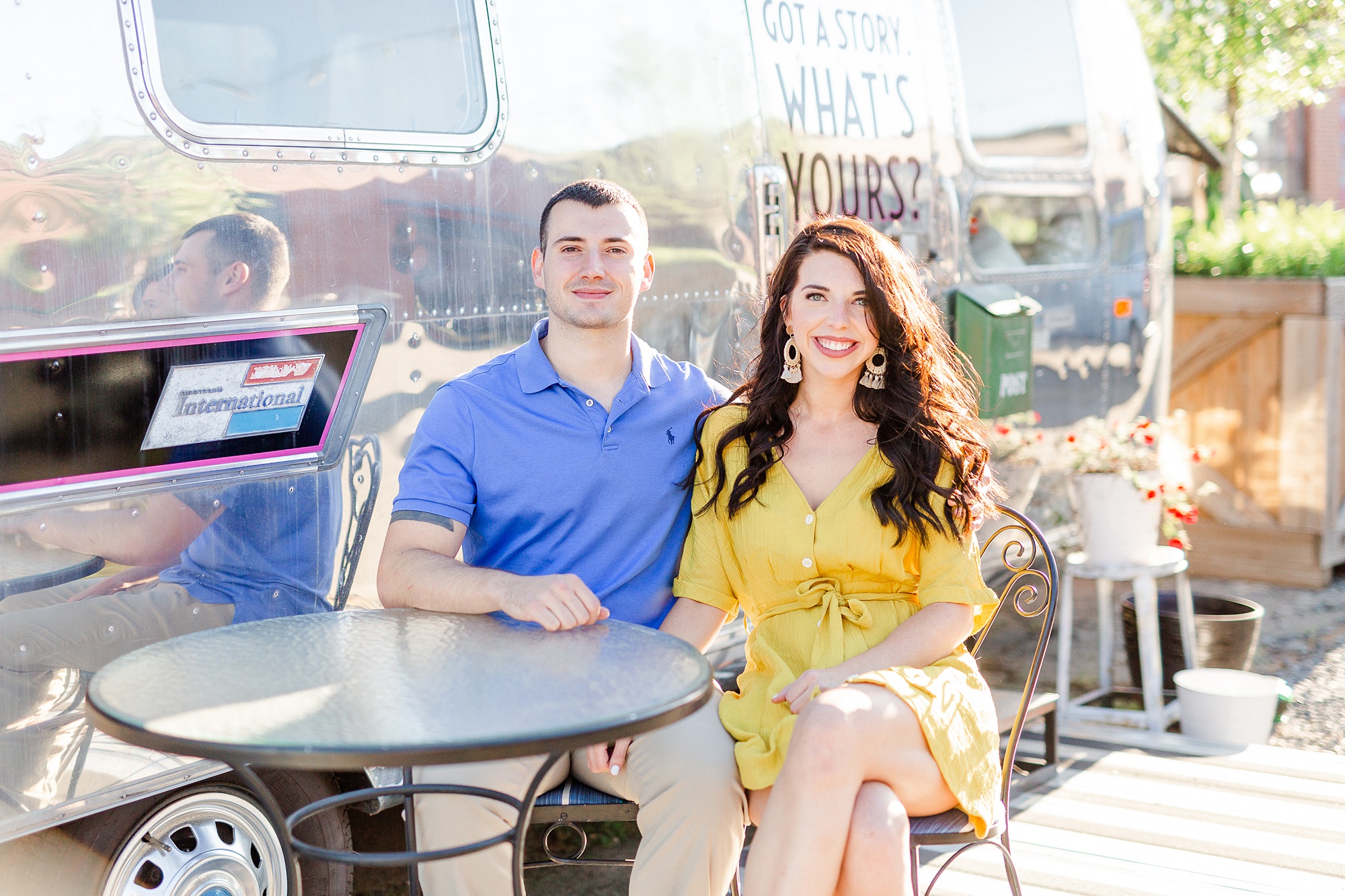 bride and groom sit together at table in Camp North End