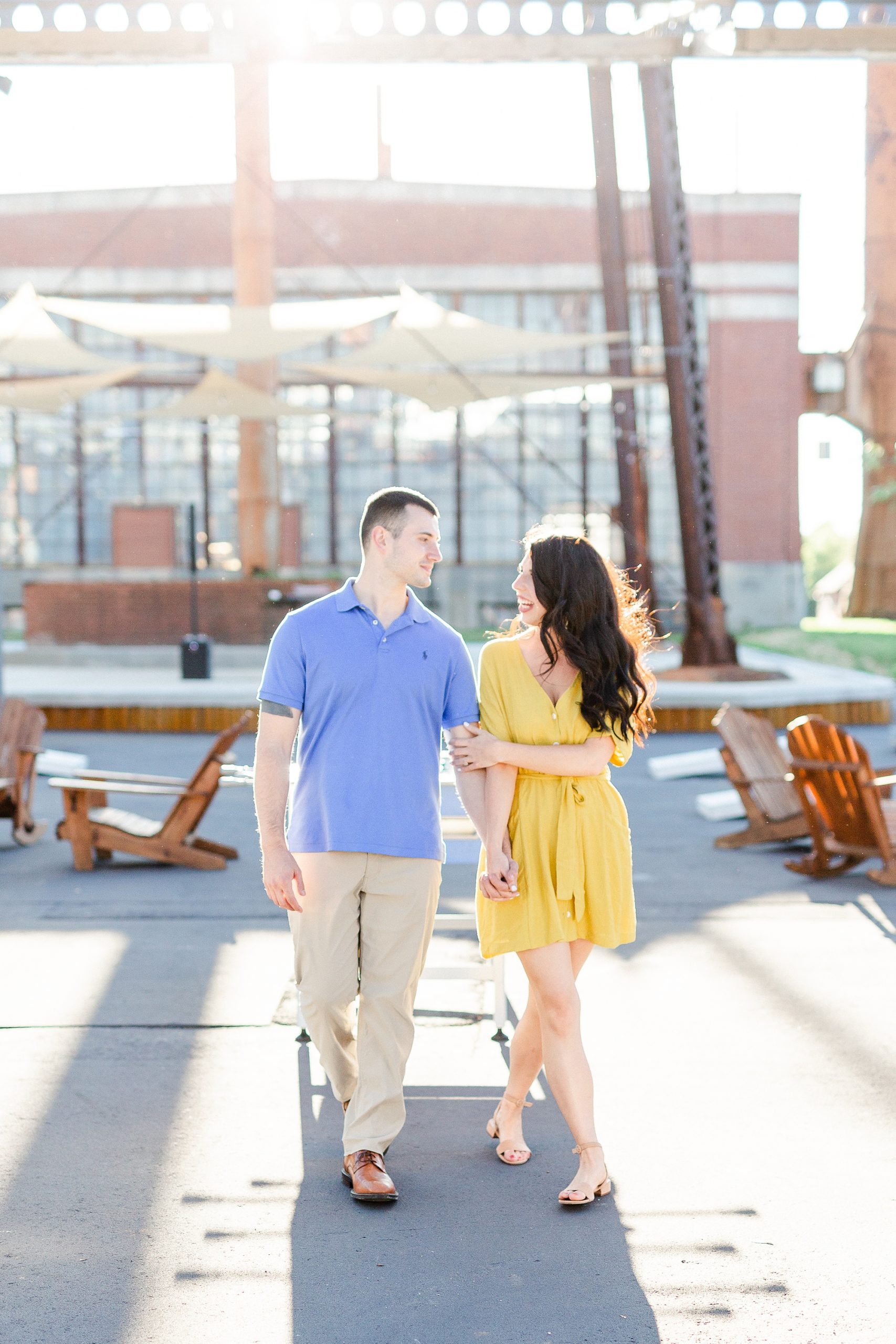 bride and groom walk in front of Black Moth Bars in Charlotte NC