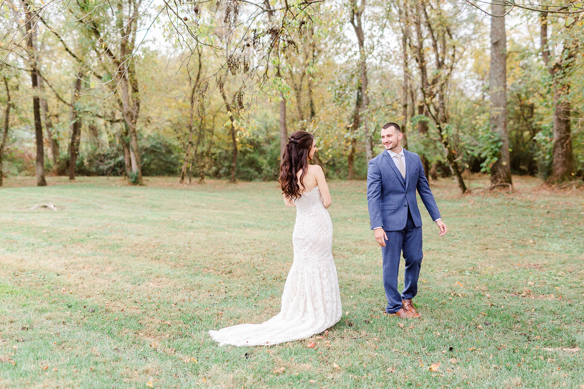 bride approaches groom during first look