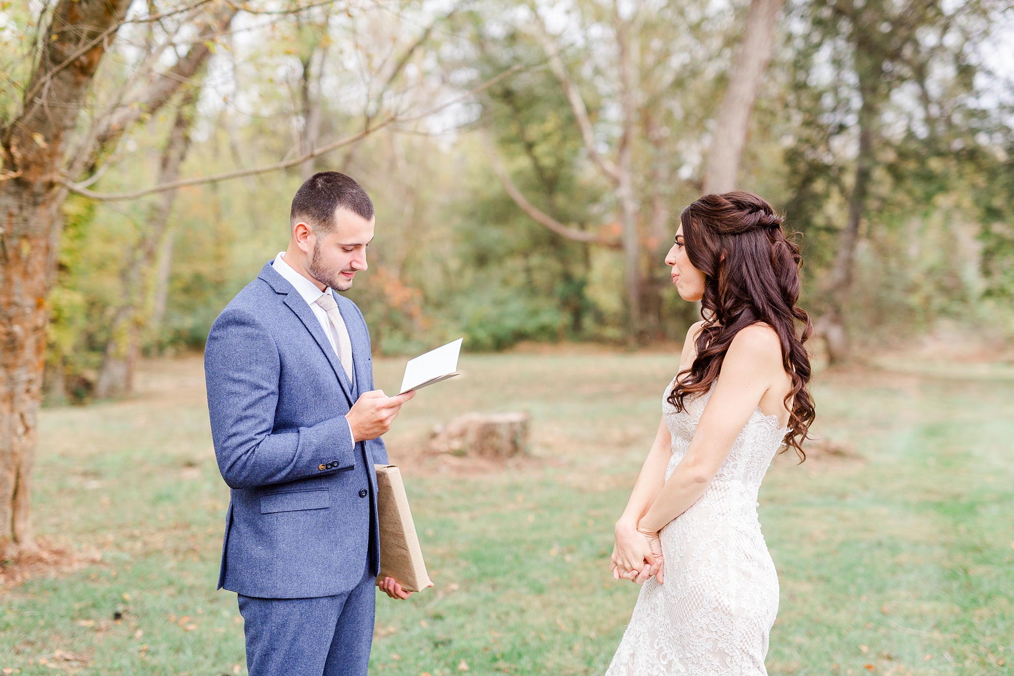 groom reads letter from bride on wedding day