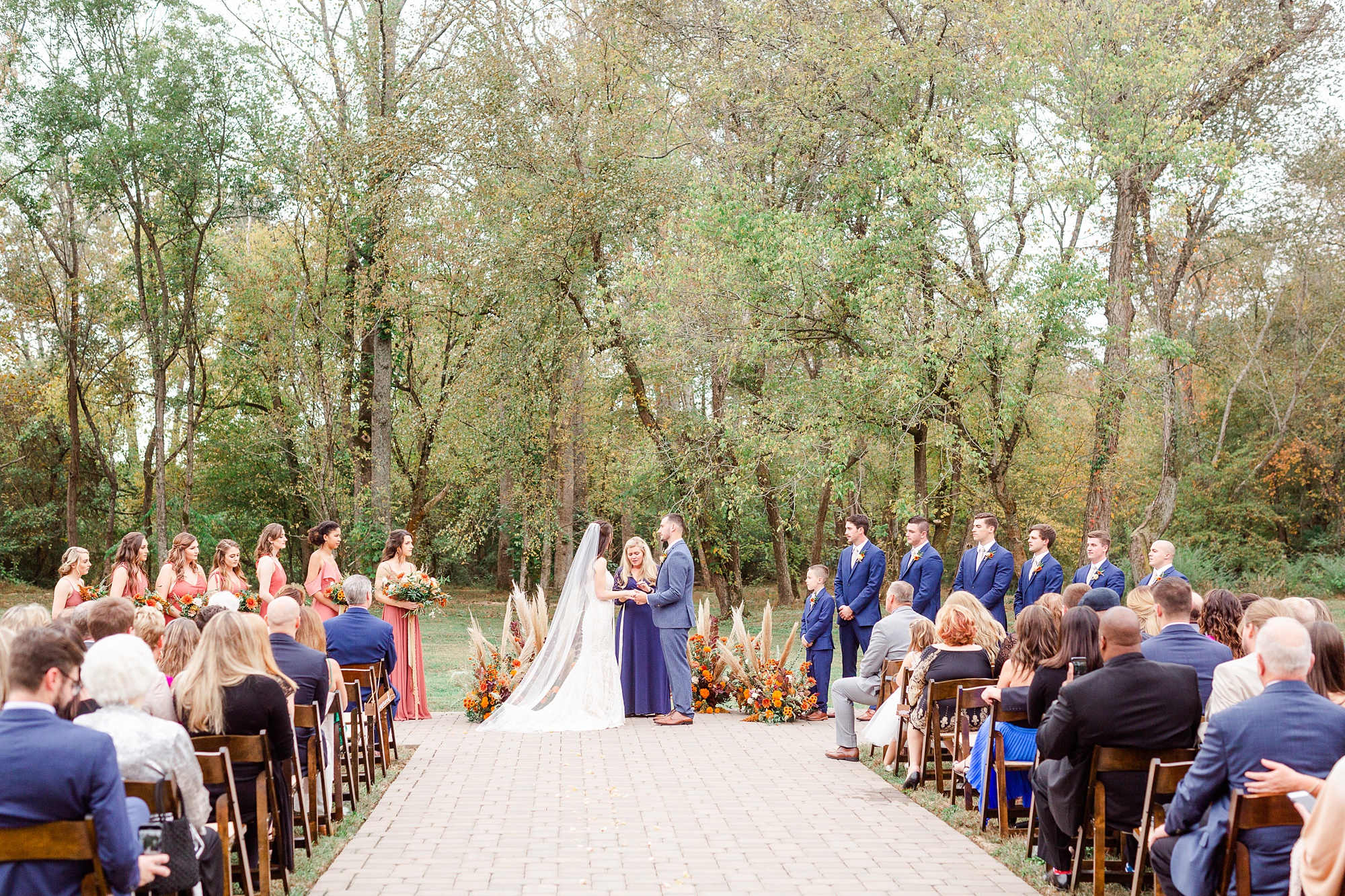 outdoor fall wedding ceremony on patio at Providence Cotton Mill