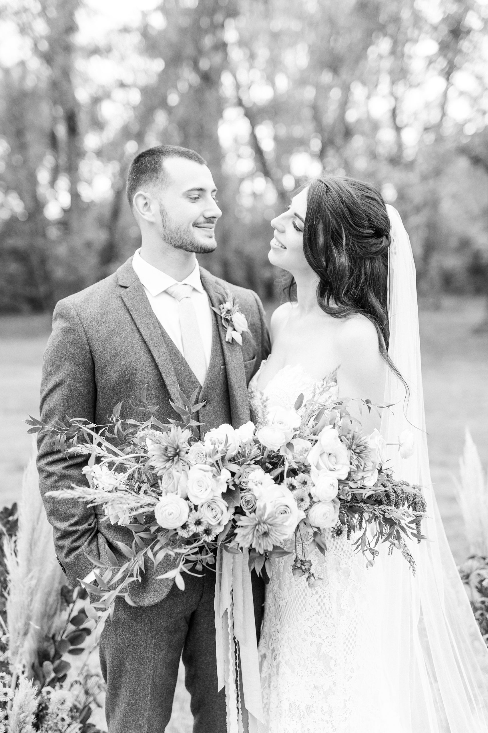 newlyweds look at each other during NC wedding photos