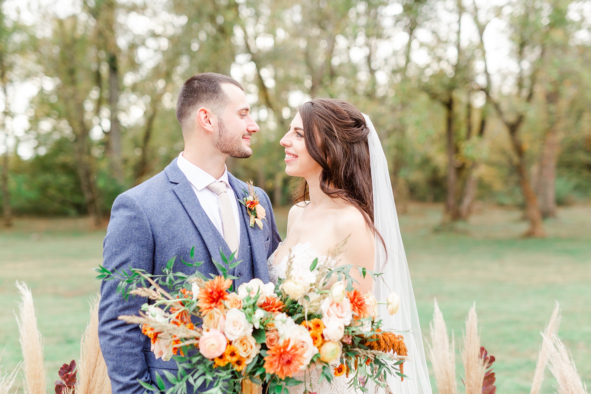 bride and groom pose together on patio at Providence Cotton Mill