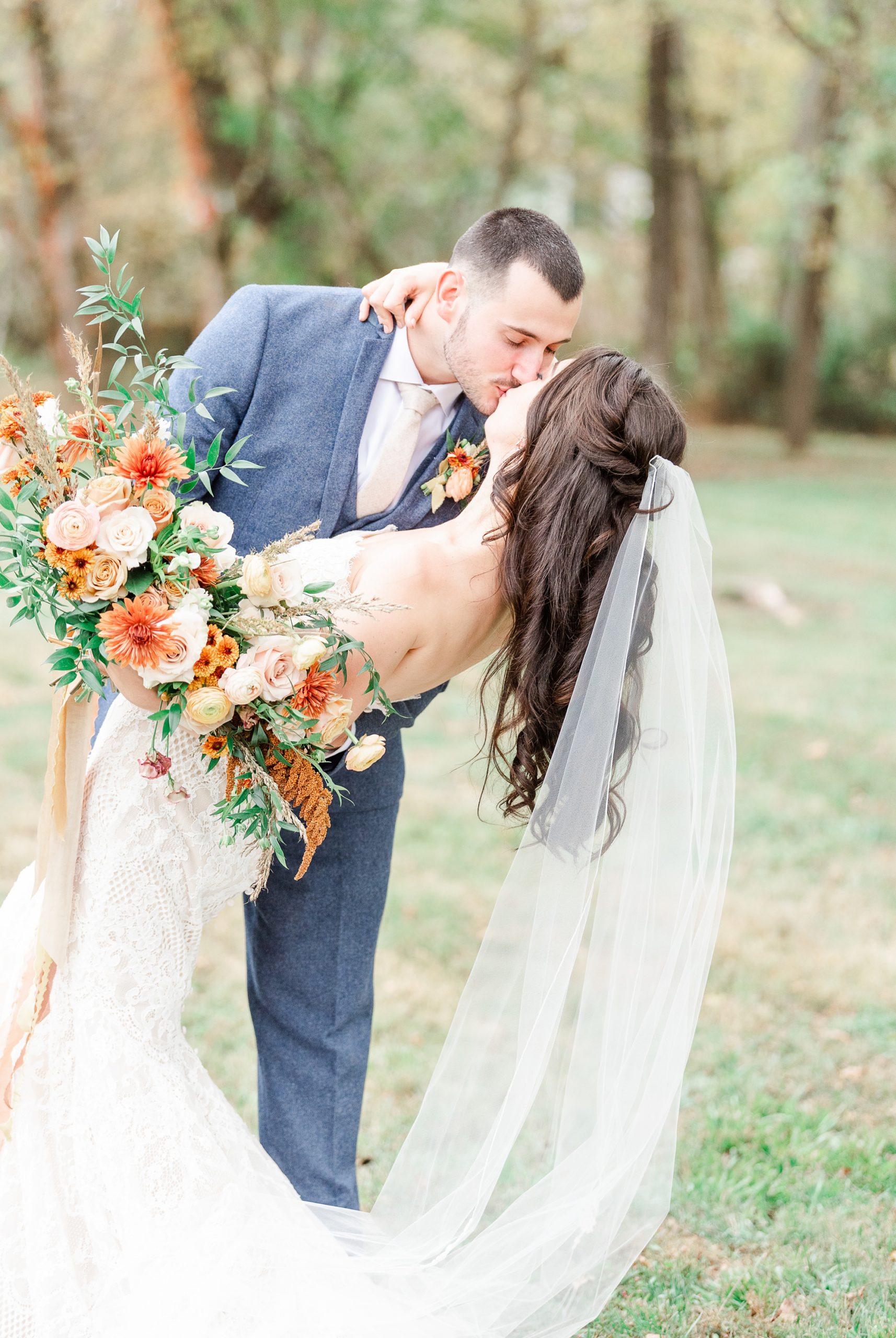 bride and groom kiss during wedding portraits at Providence Cotton Mill