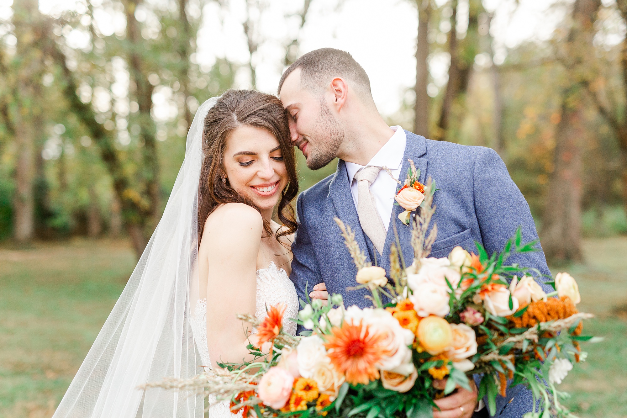 groom leans over to nuzzle bride during wedding photos at Providence Cotton Mill
