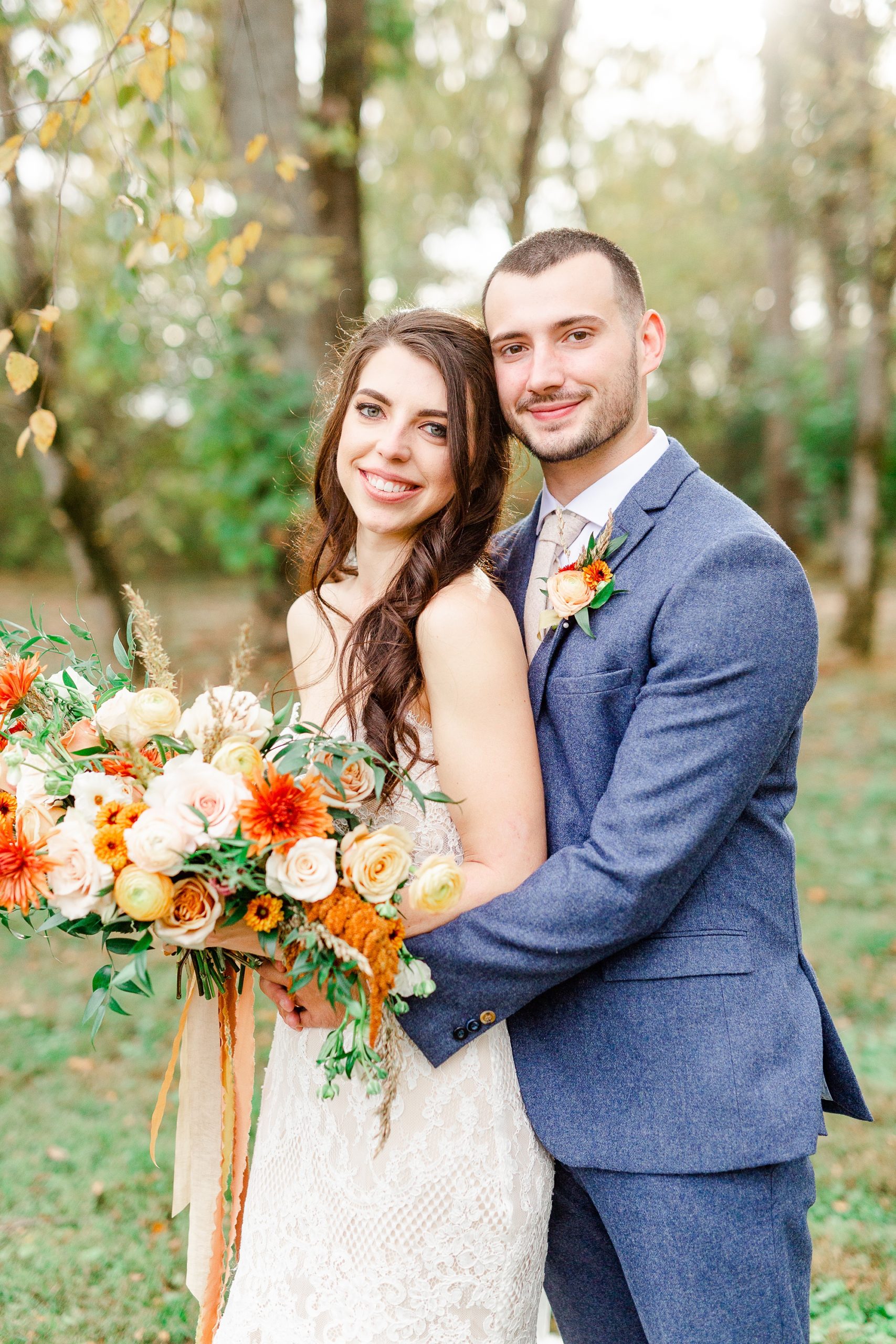 groom hugs bride during Providence Cotton Mill wedding photos