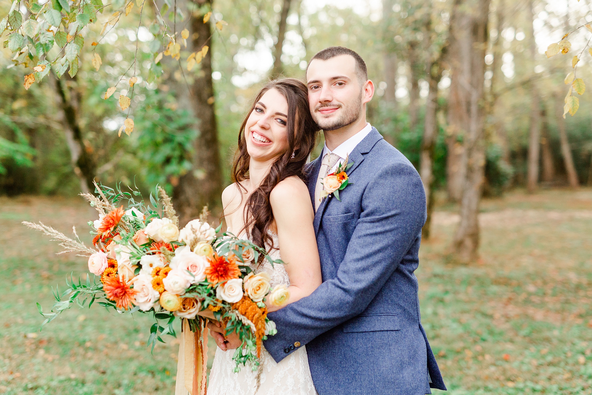bride leans against groom during wedding portraits in NC