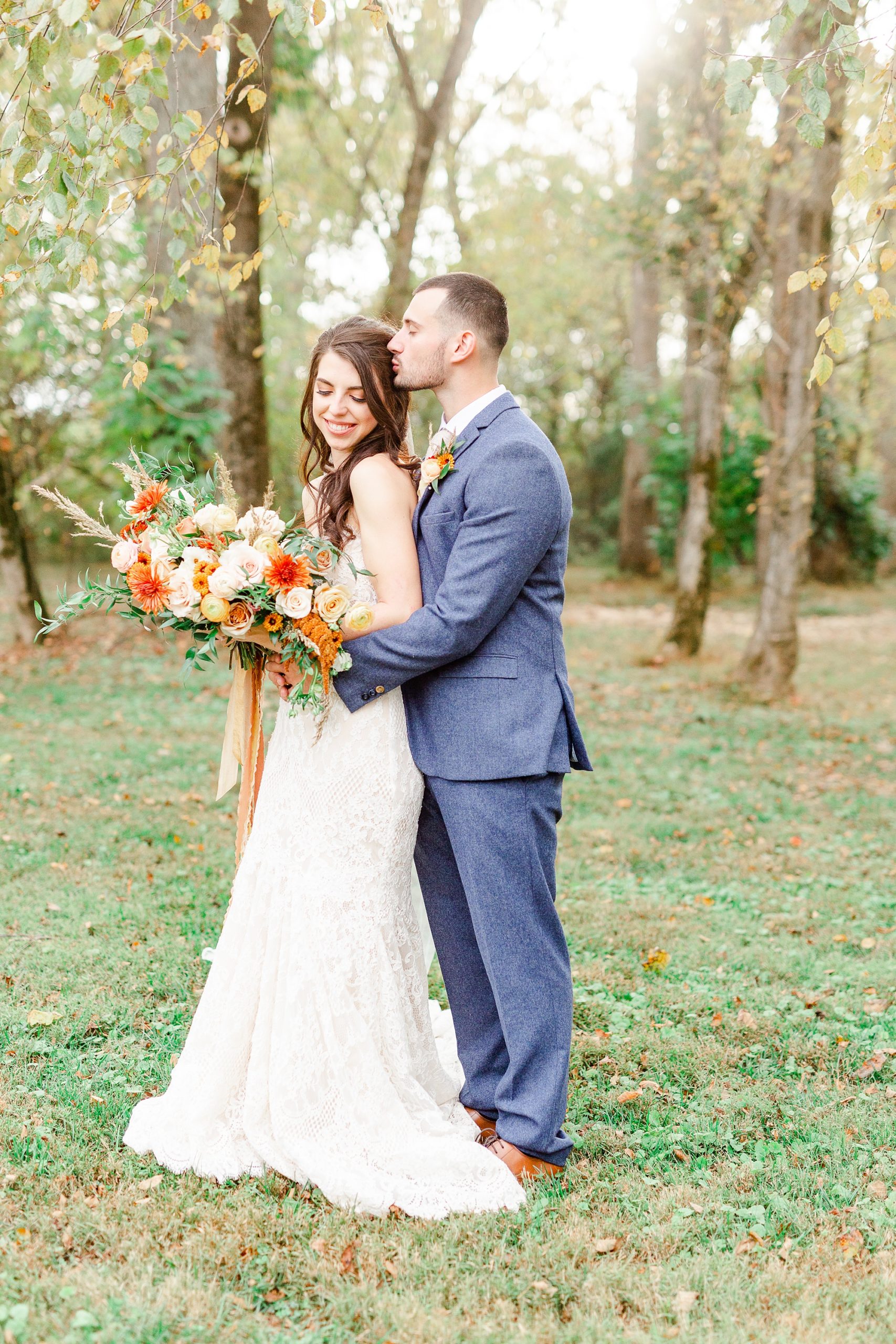 bride and groom hug during Providence Cotton Mill wedding portraits
