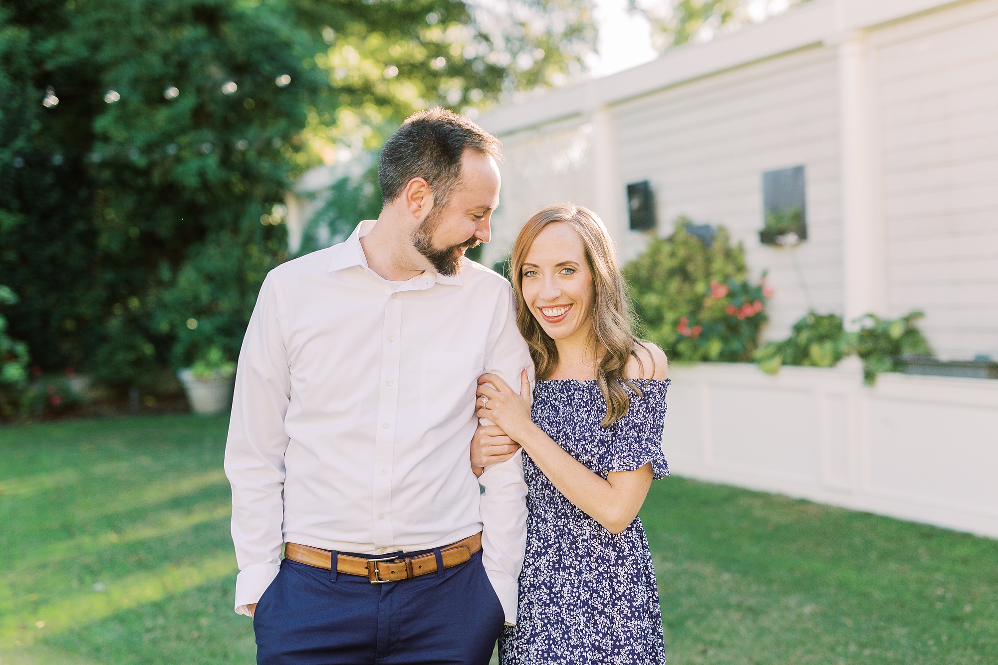 bride and groom pose on lawn at Separk Mansion