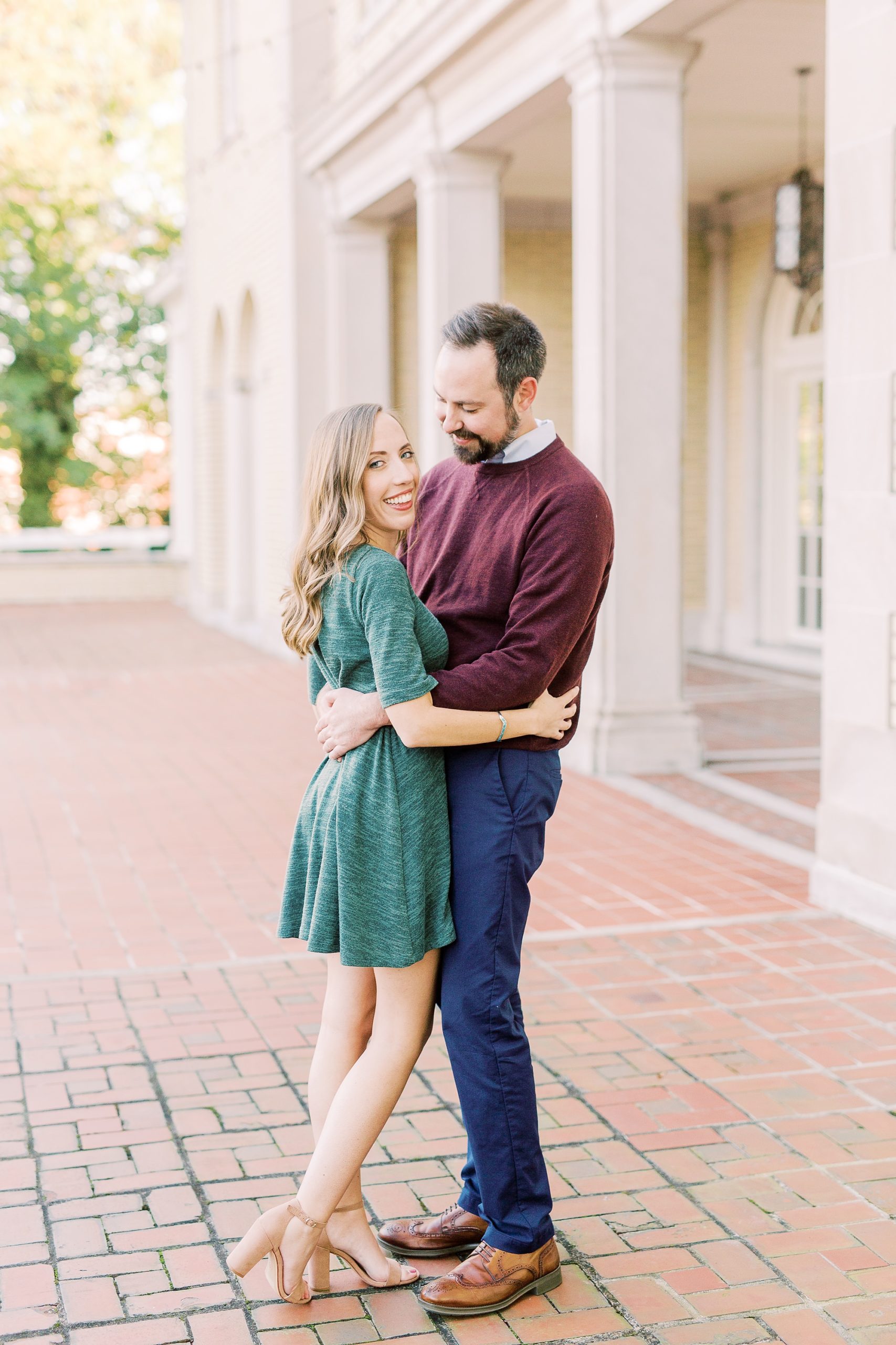 bride laughs hugging groom during NC engagement session