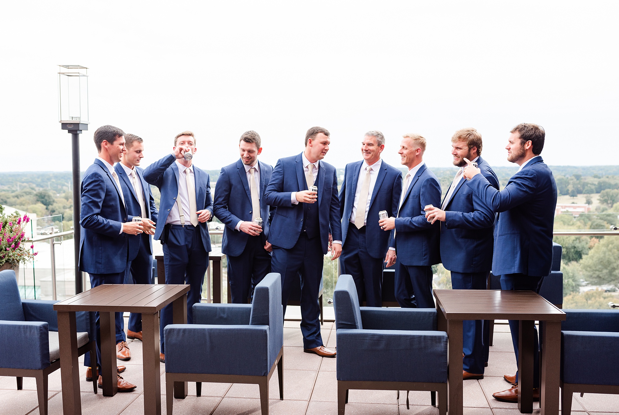 groom and groomsmen toast before wedding day