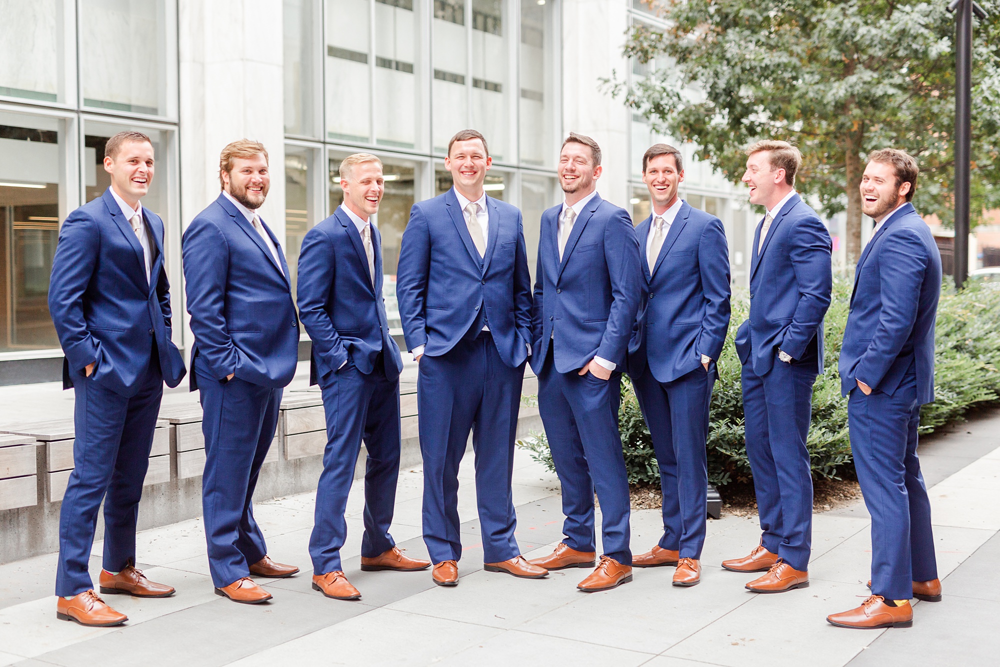 groomsmen in navy suits pose with NC groom