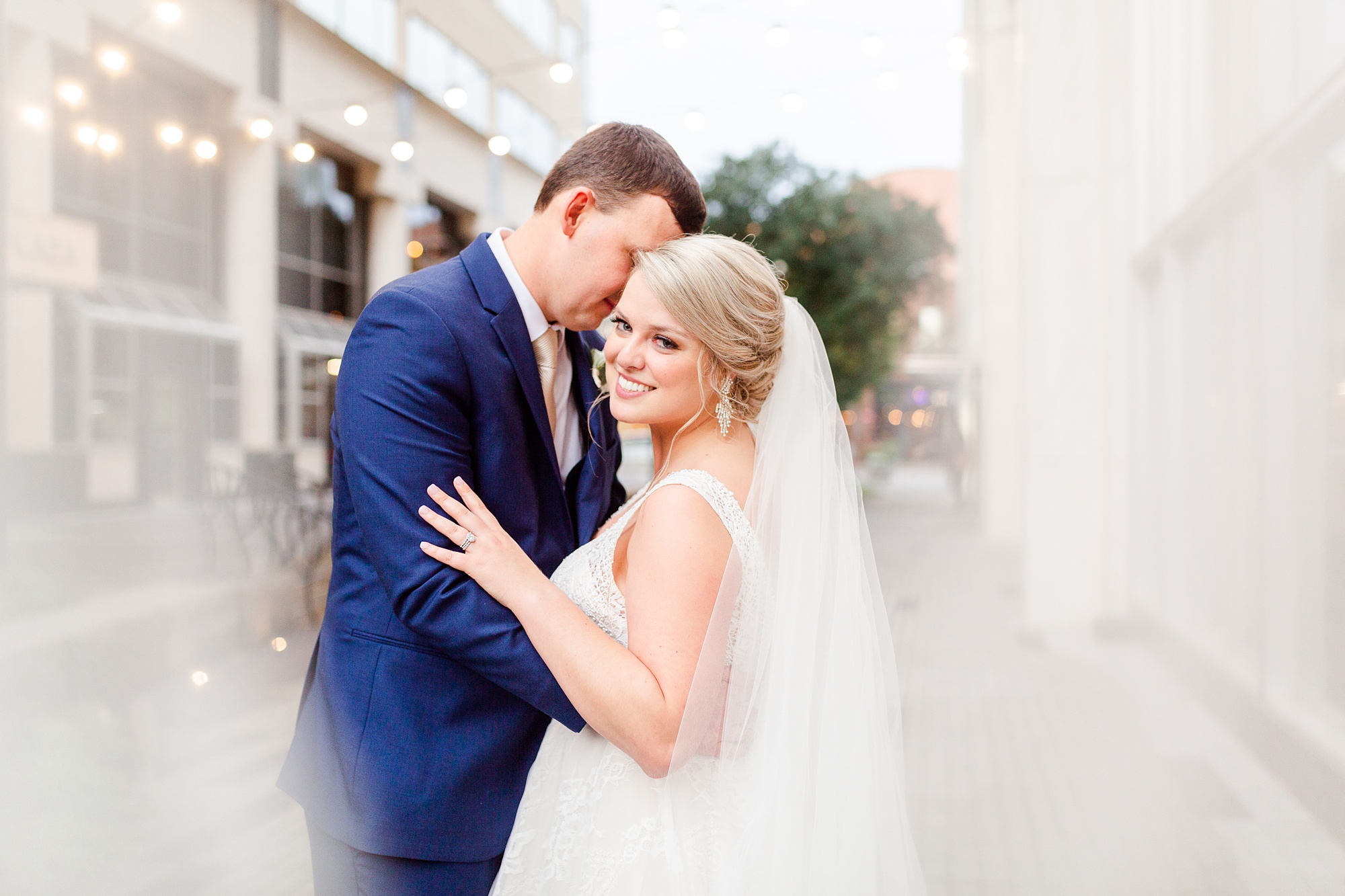 groom nuzzles bride's cheek during Stockroom at 230 wedding photos