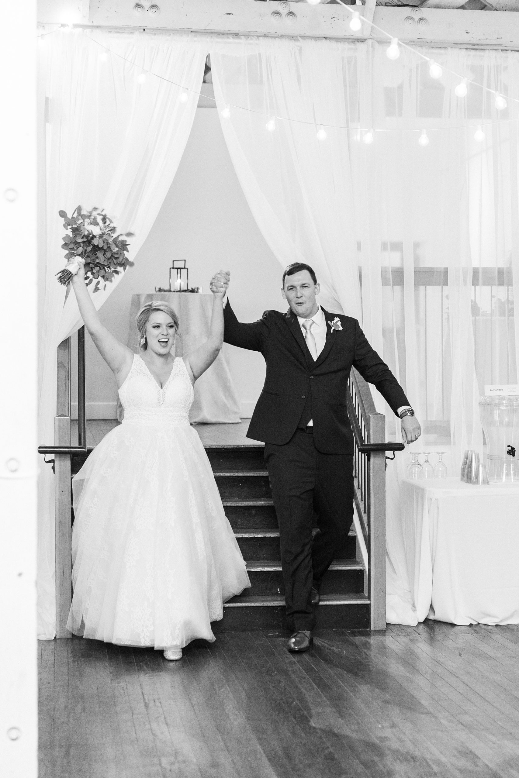 bride and groom enter Raleigh NC wedding reception