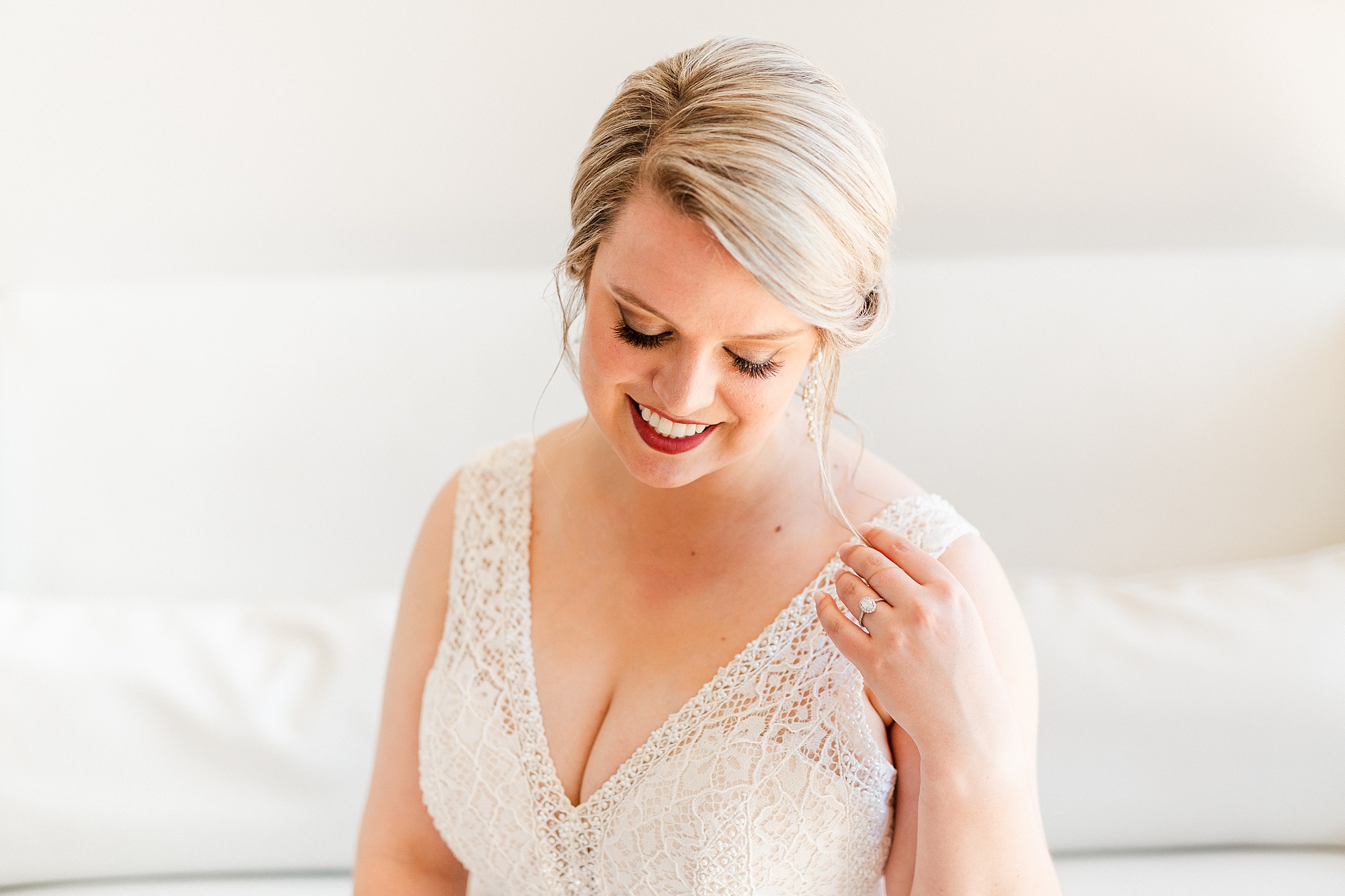 bride looks down at lap during wedding photos in Raleigh NC