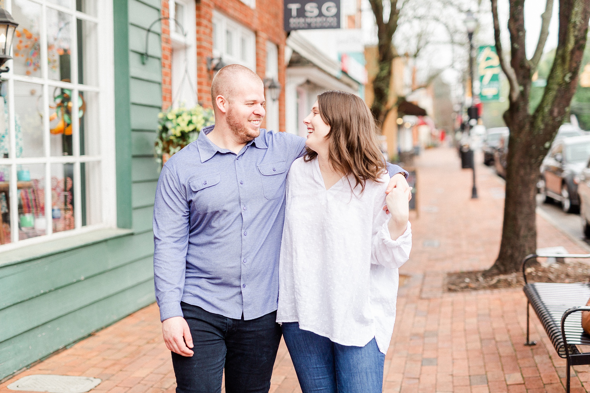bride and groom walk down sidewalk in NC