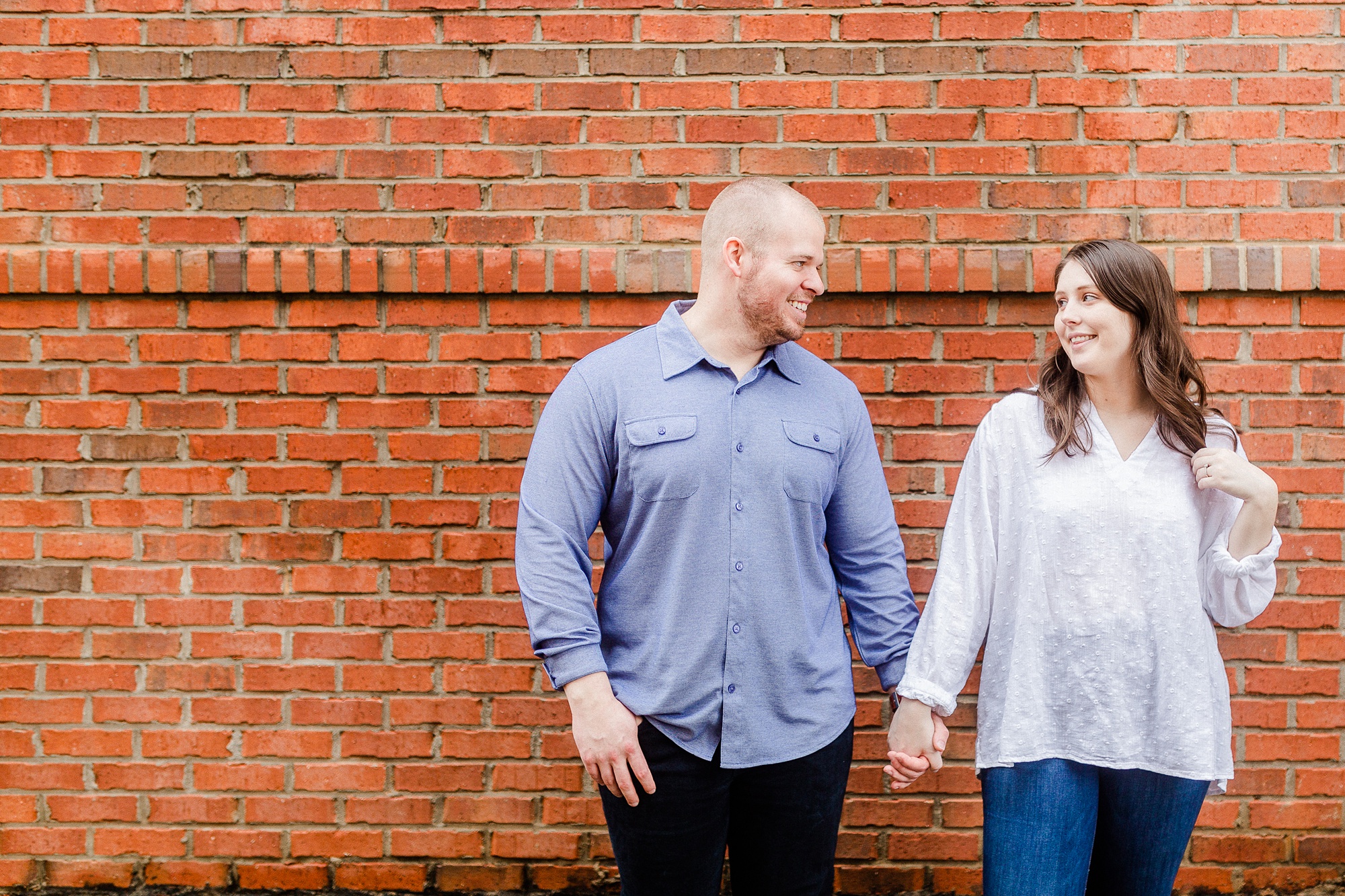 casual spring engagement portraits in Downtown Davidson