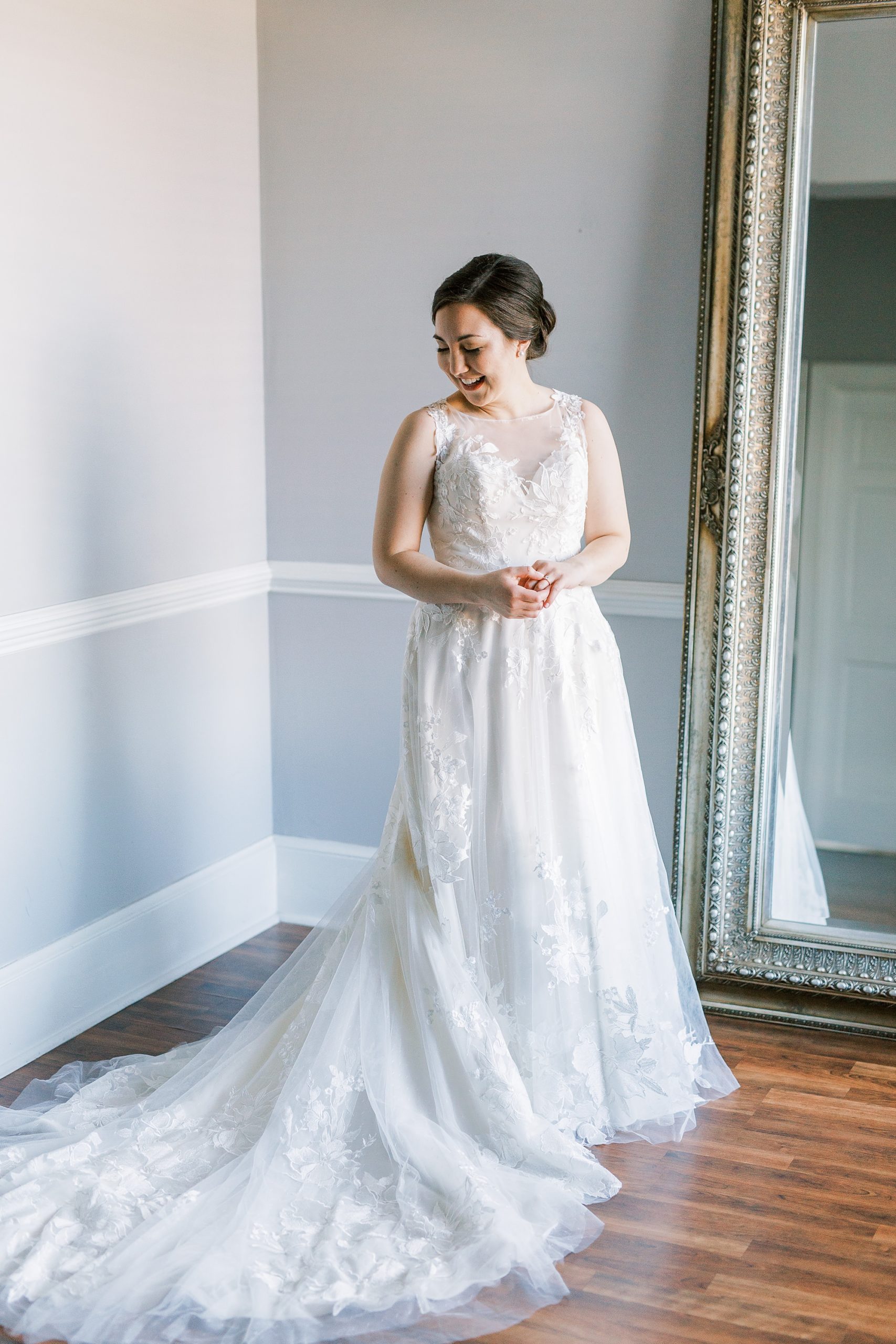 bride prepares for wedding day by mirrors at Separk Mansion