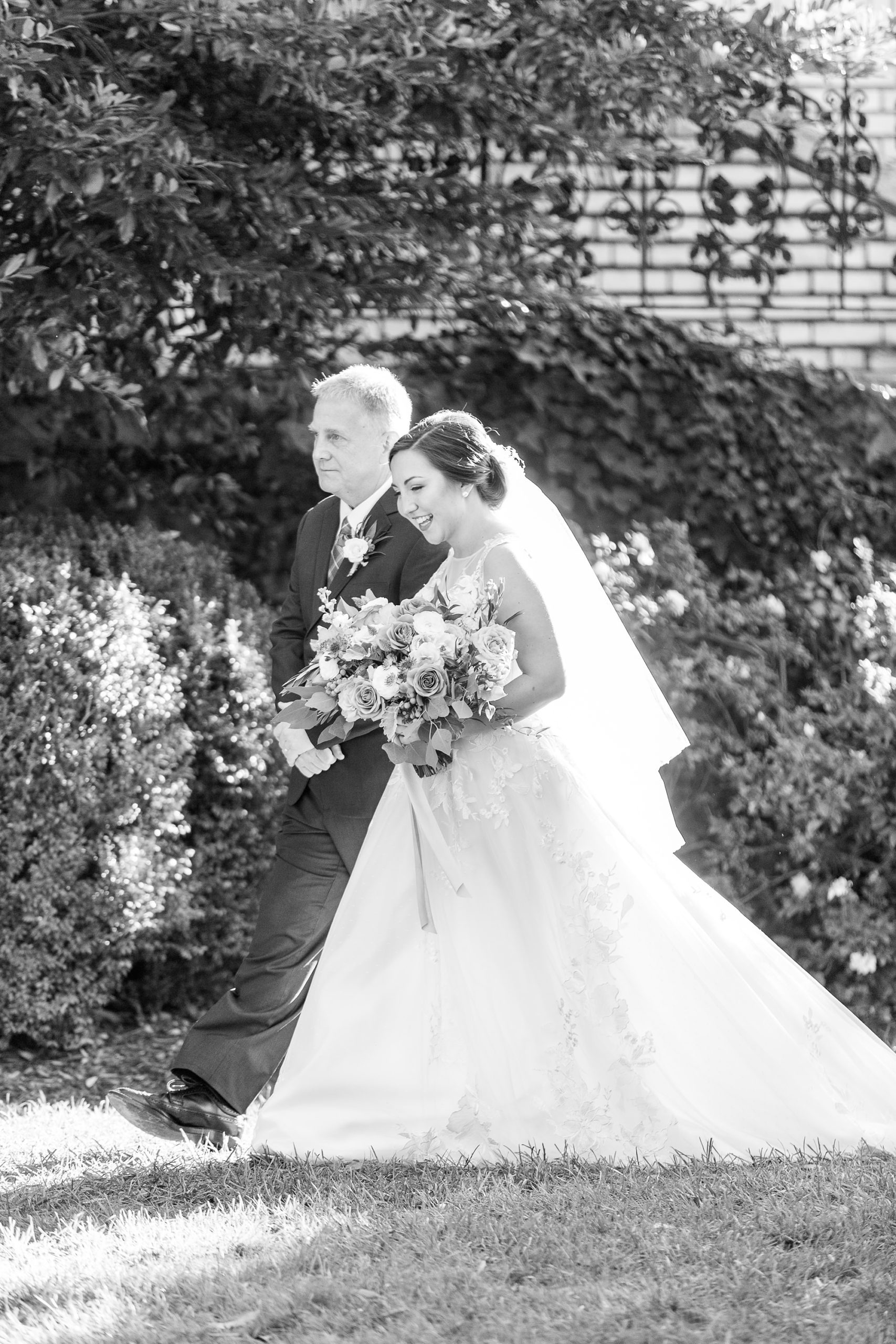 bride enters wedding ceremony with dad