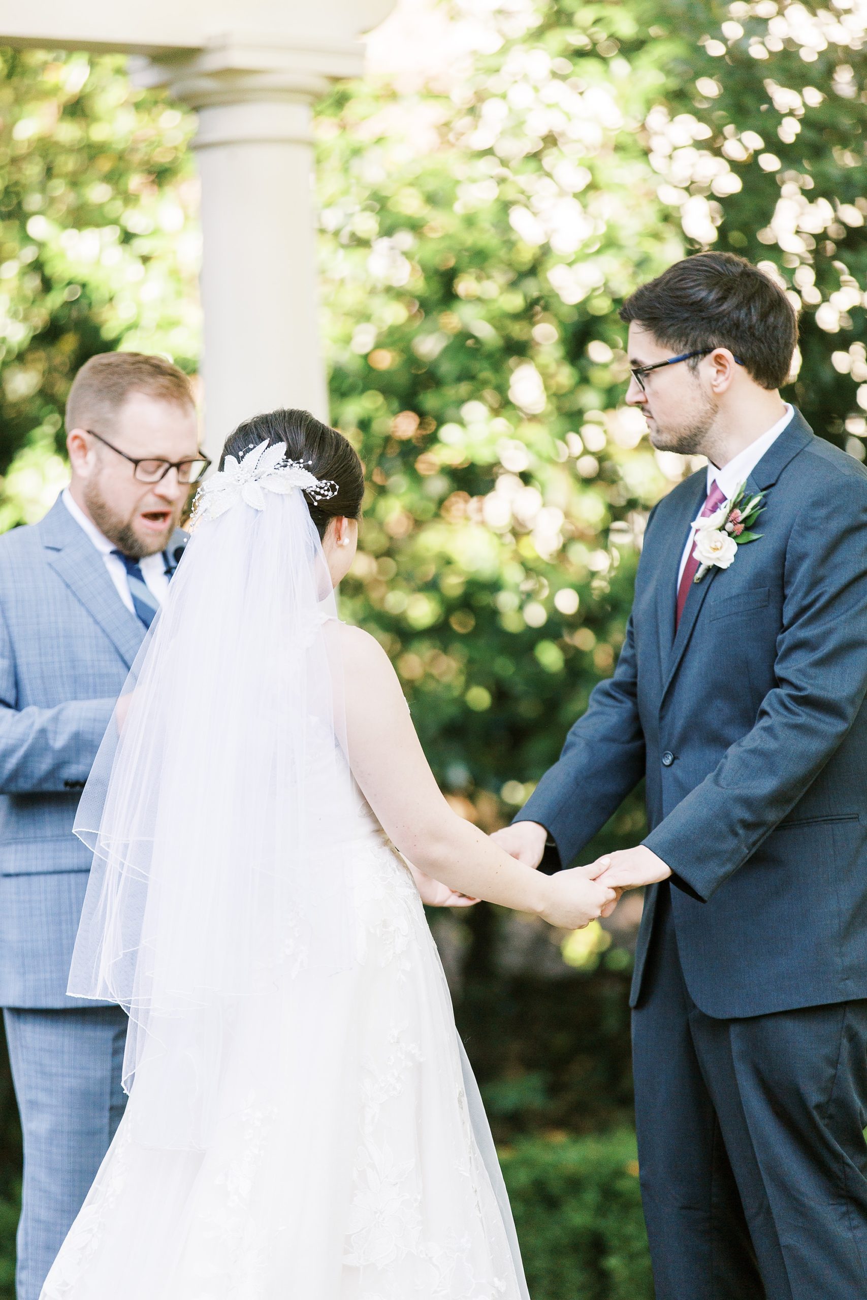 bride and groom exchange vows during wedding ceremony in Charlotte NC