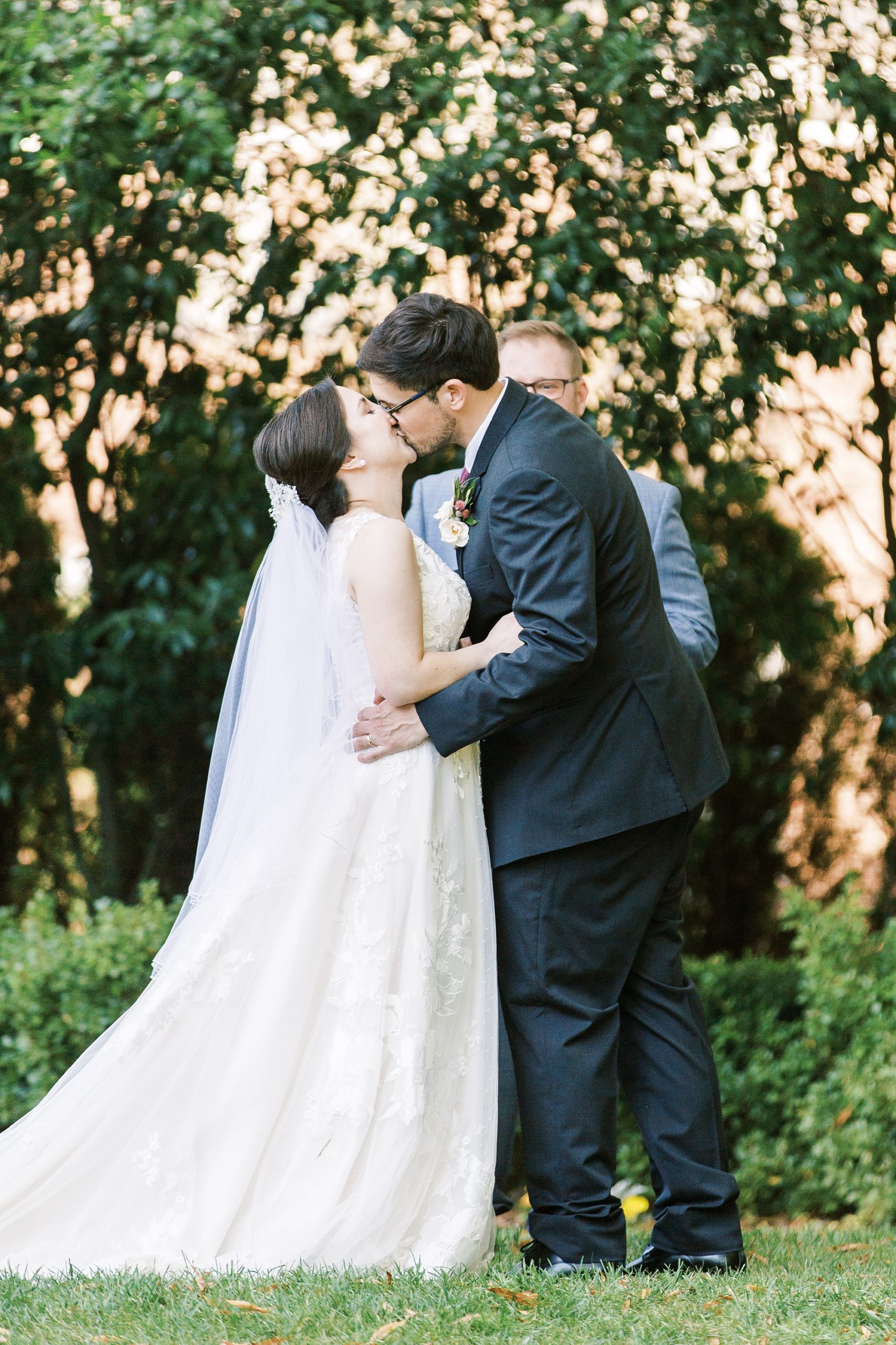 newlyweds kiss after wedding ceremony in Charlotte NC