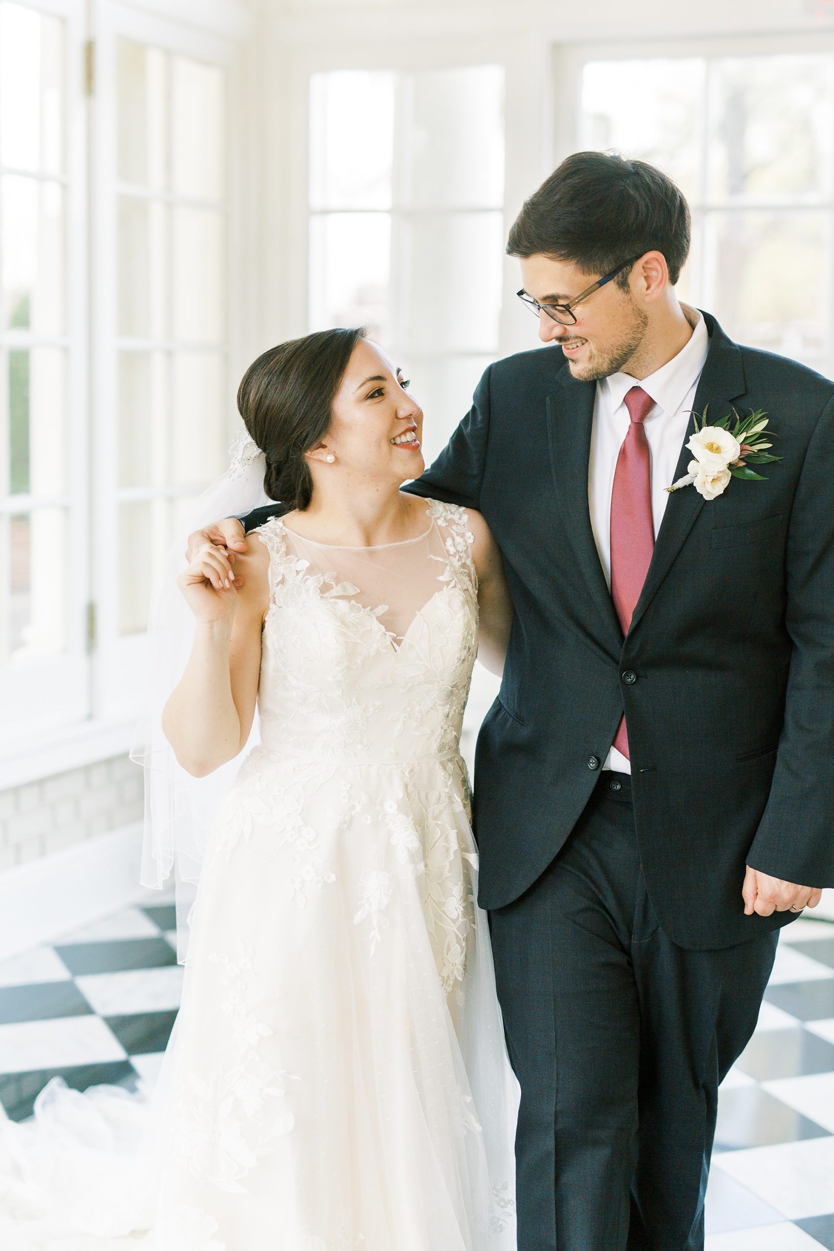 newlyweds walk through patio room at Separk Mansion