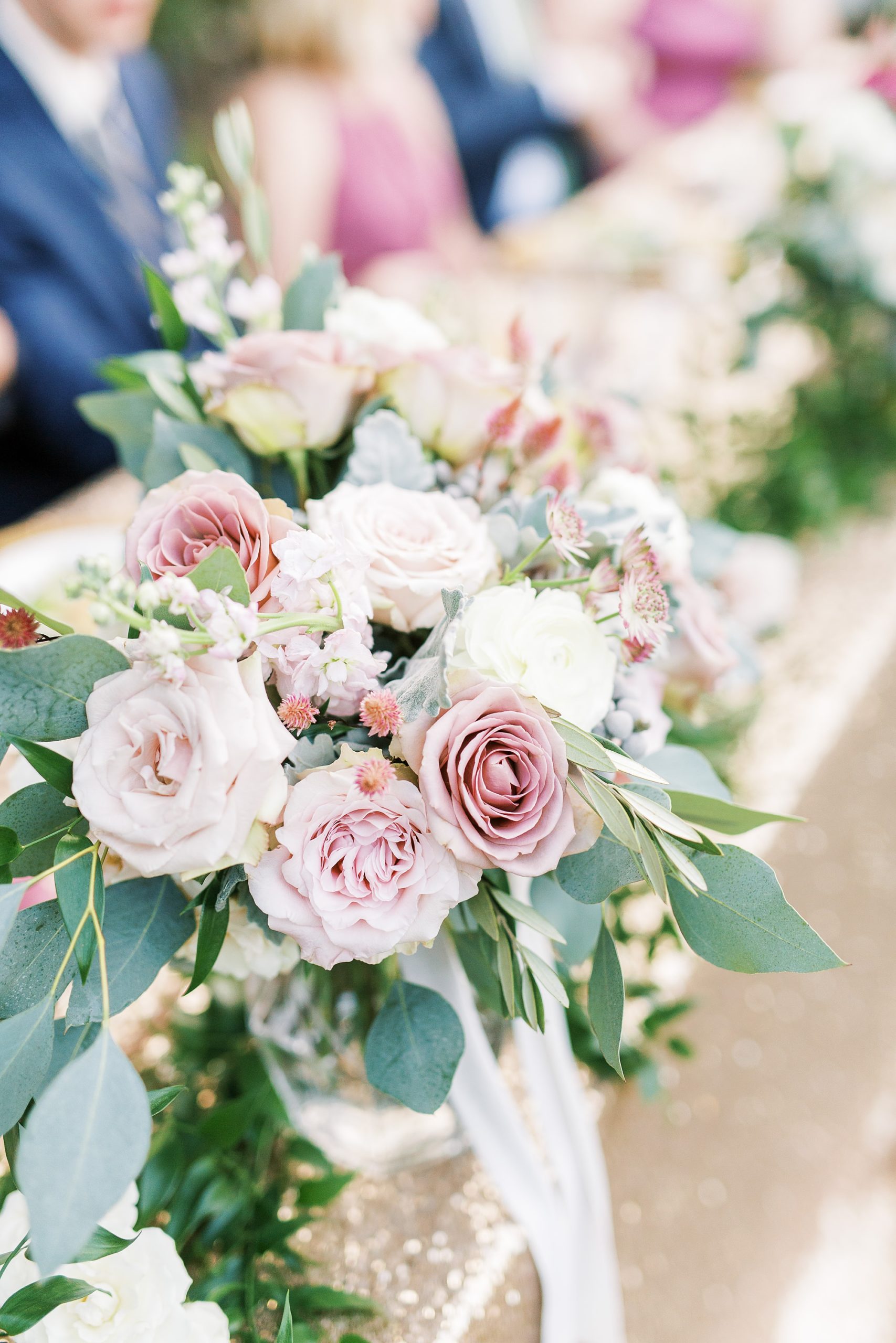 mauve fall wedding bouquet on reception table