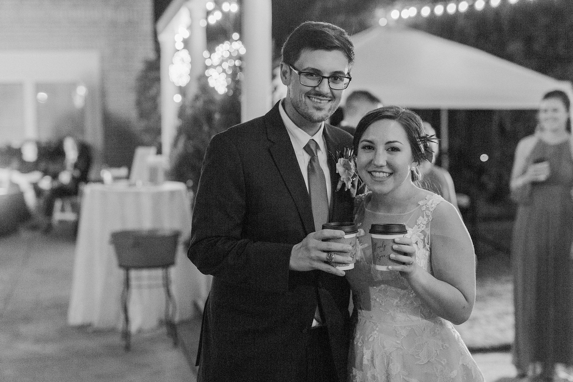 bride and groom toast cups of coffee during wedding reception at Separk Mansion