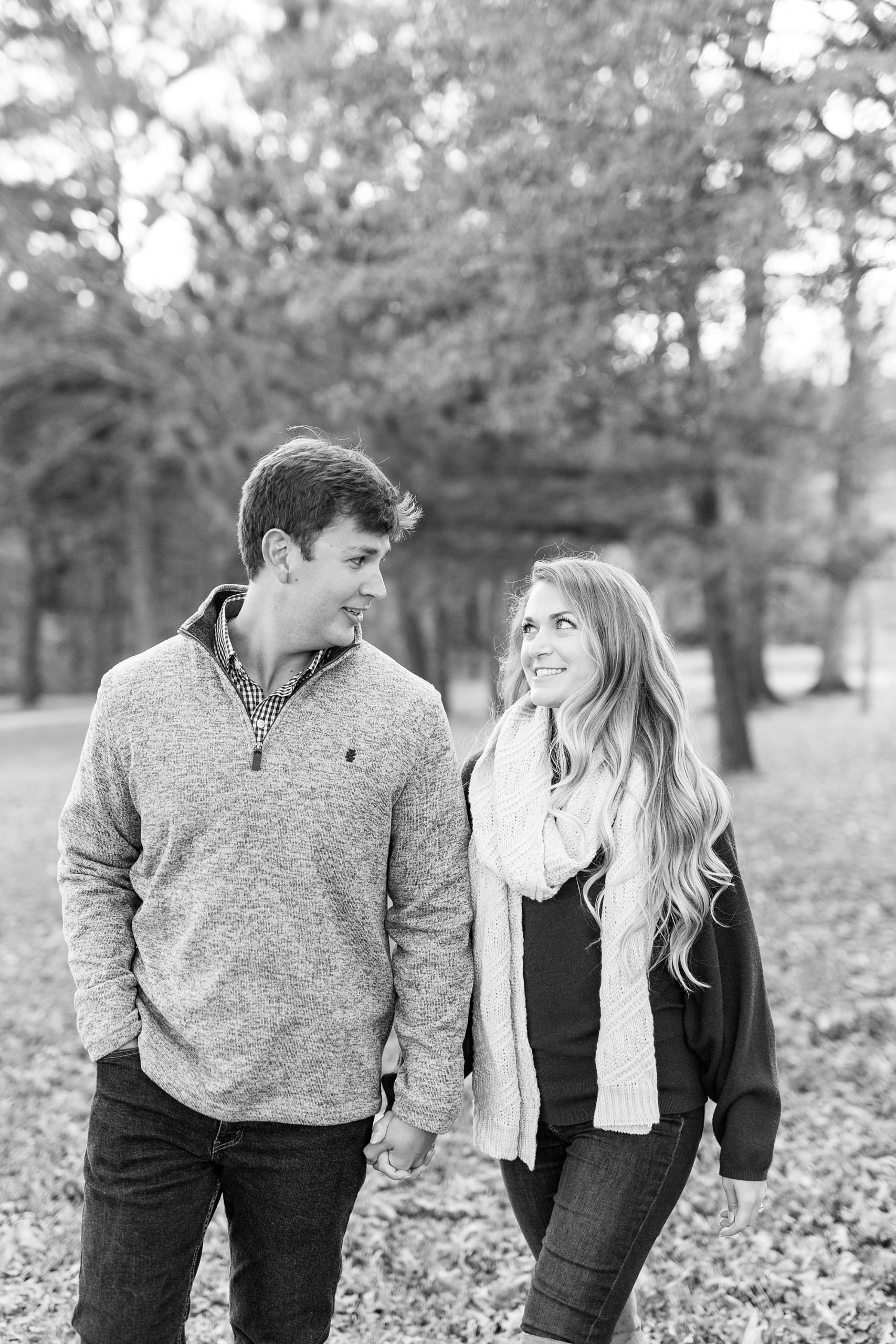 engaged couple walks through NC Museum of Art