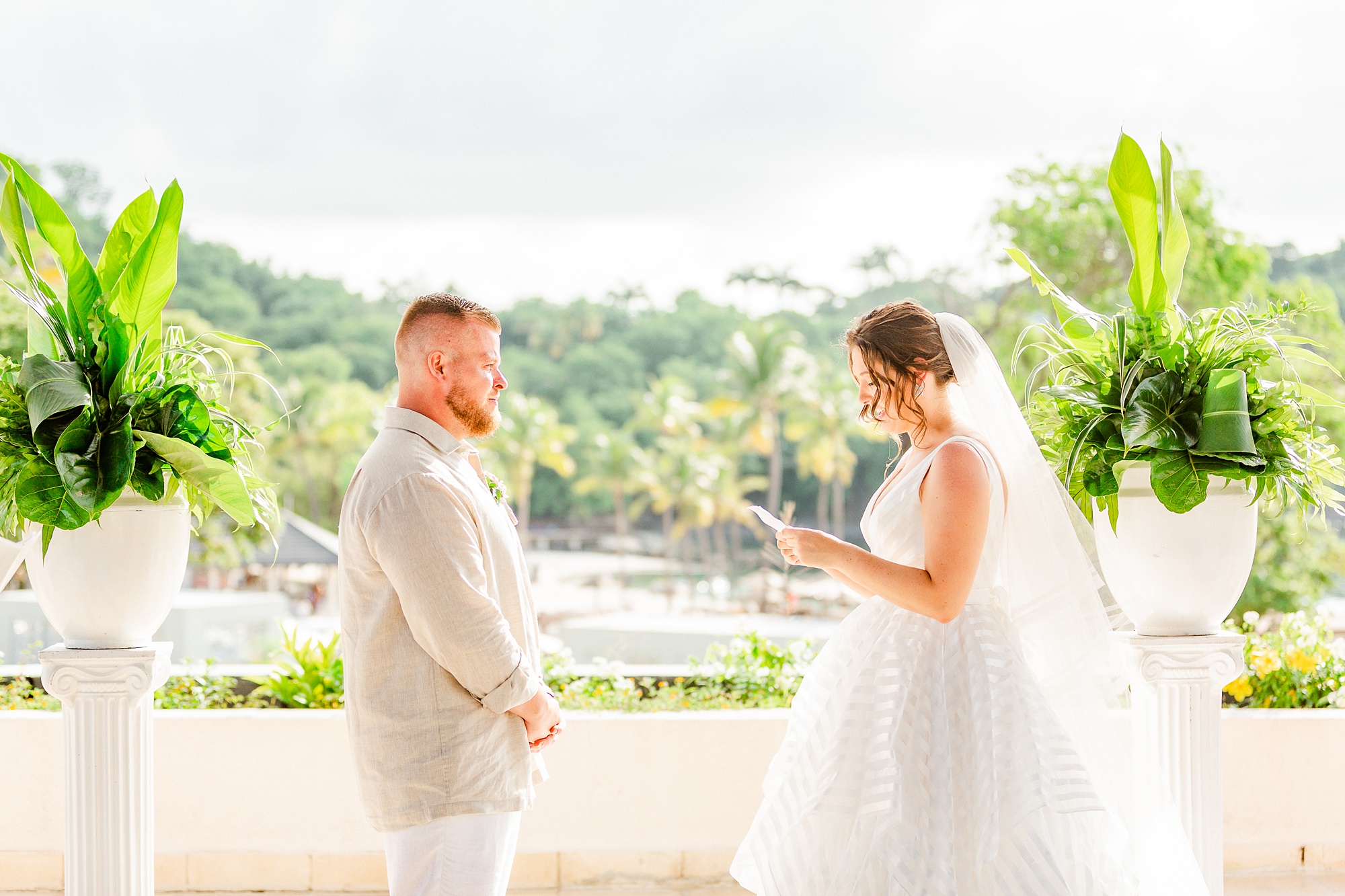 bride reads vows during wedding ceremony