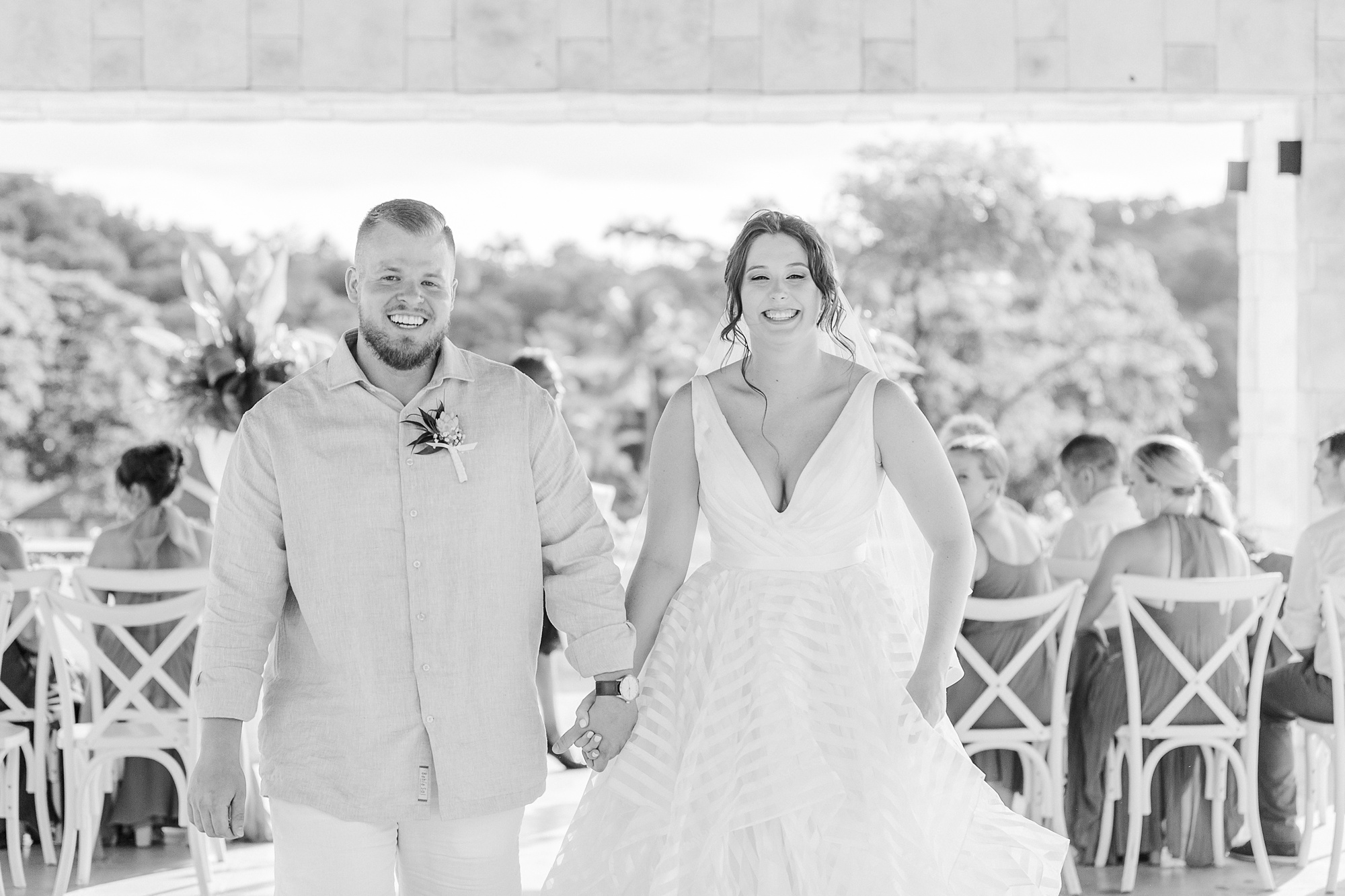 newlyweds walk up aisle after wedding ceremony