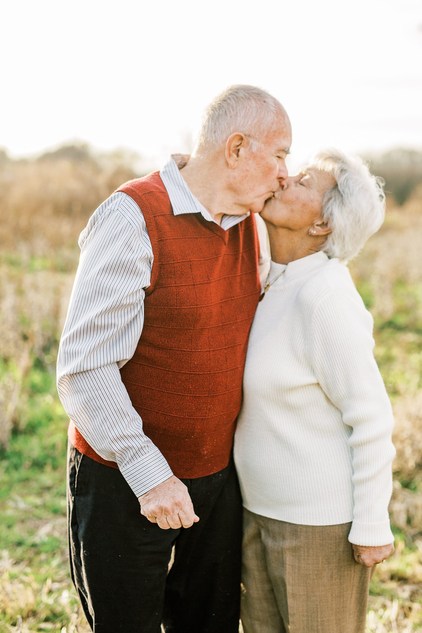 couple kisses during 50th anniversary photos