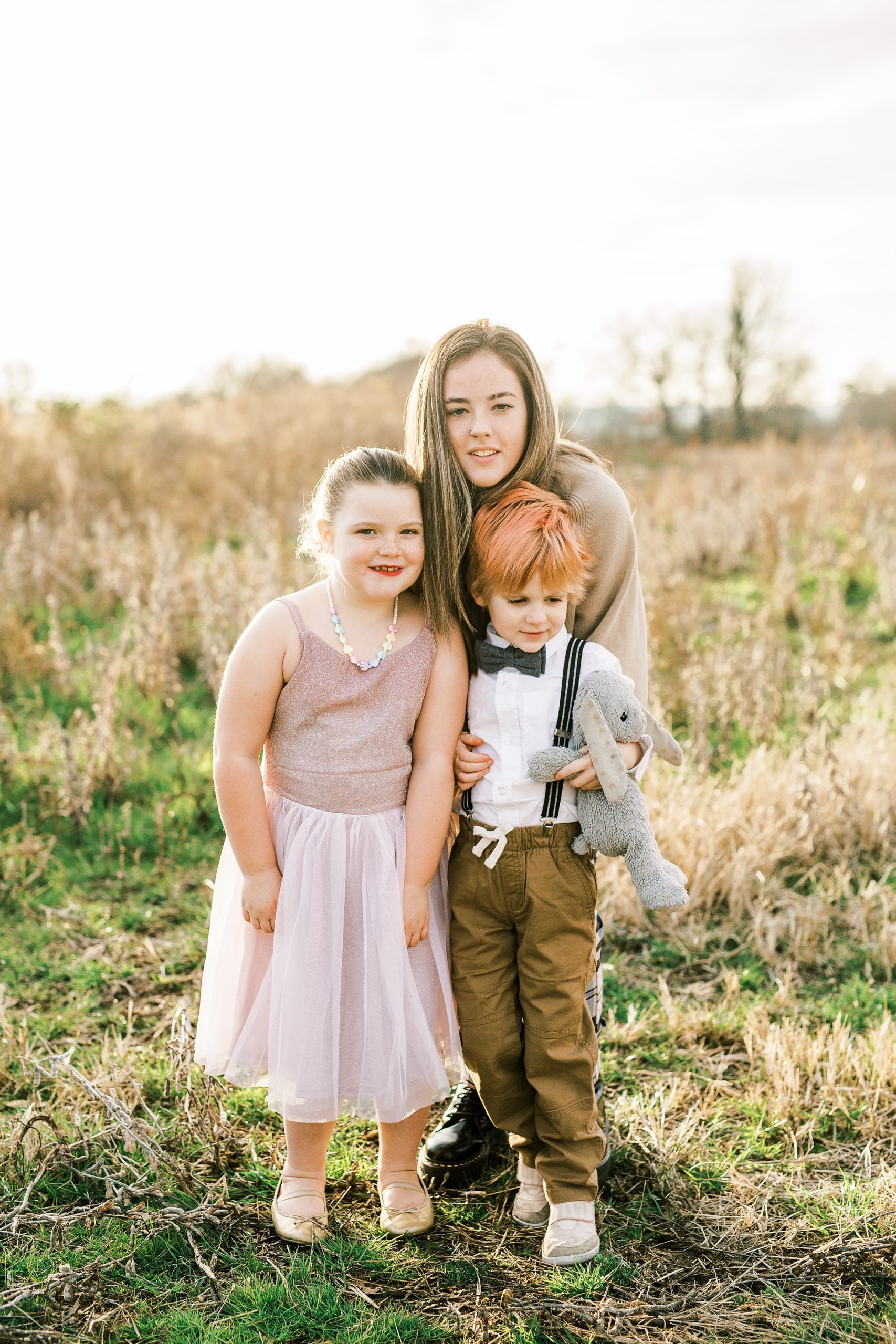cousins pose together during family photos in Charlotte NC