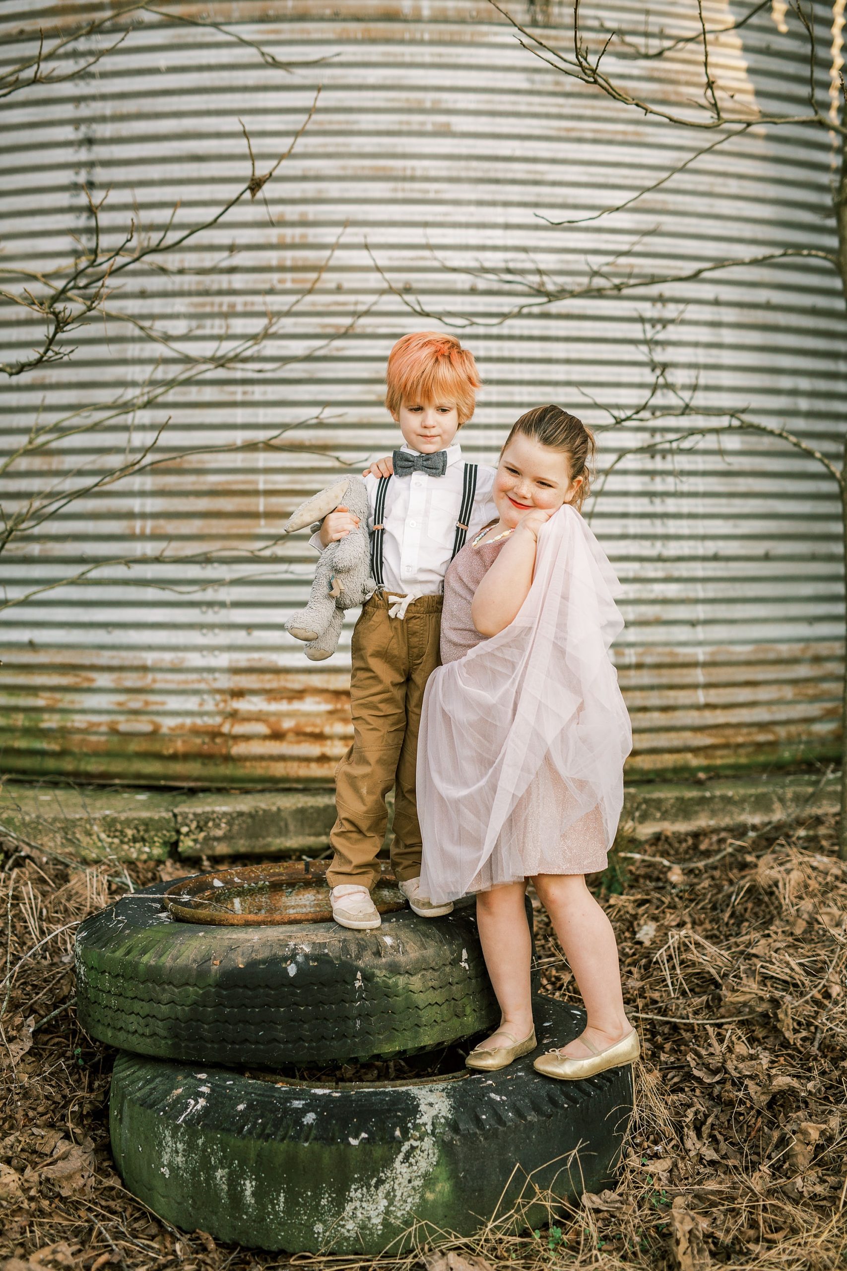 kids play on tires on family farm