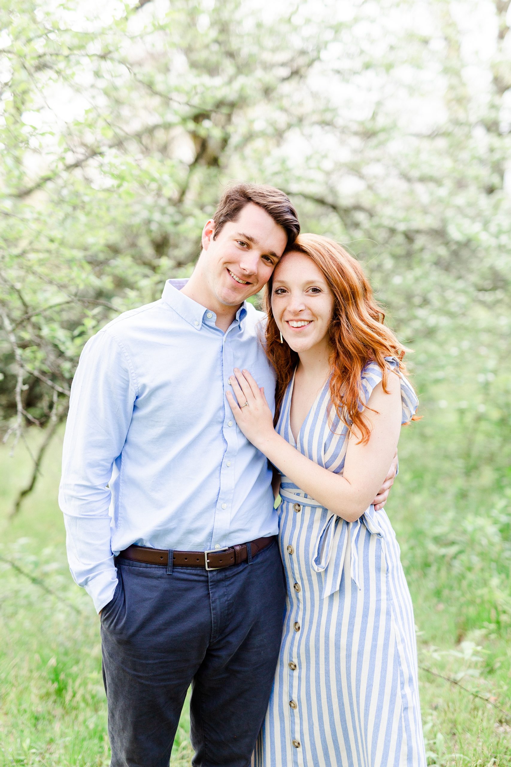 Boone NC spring engagement photos in front of blossoming tree