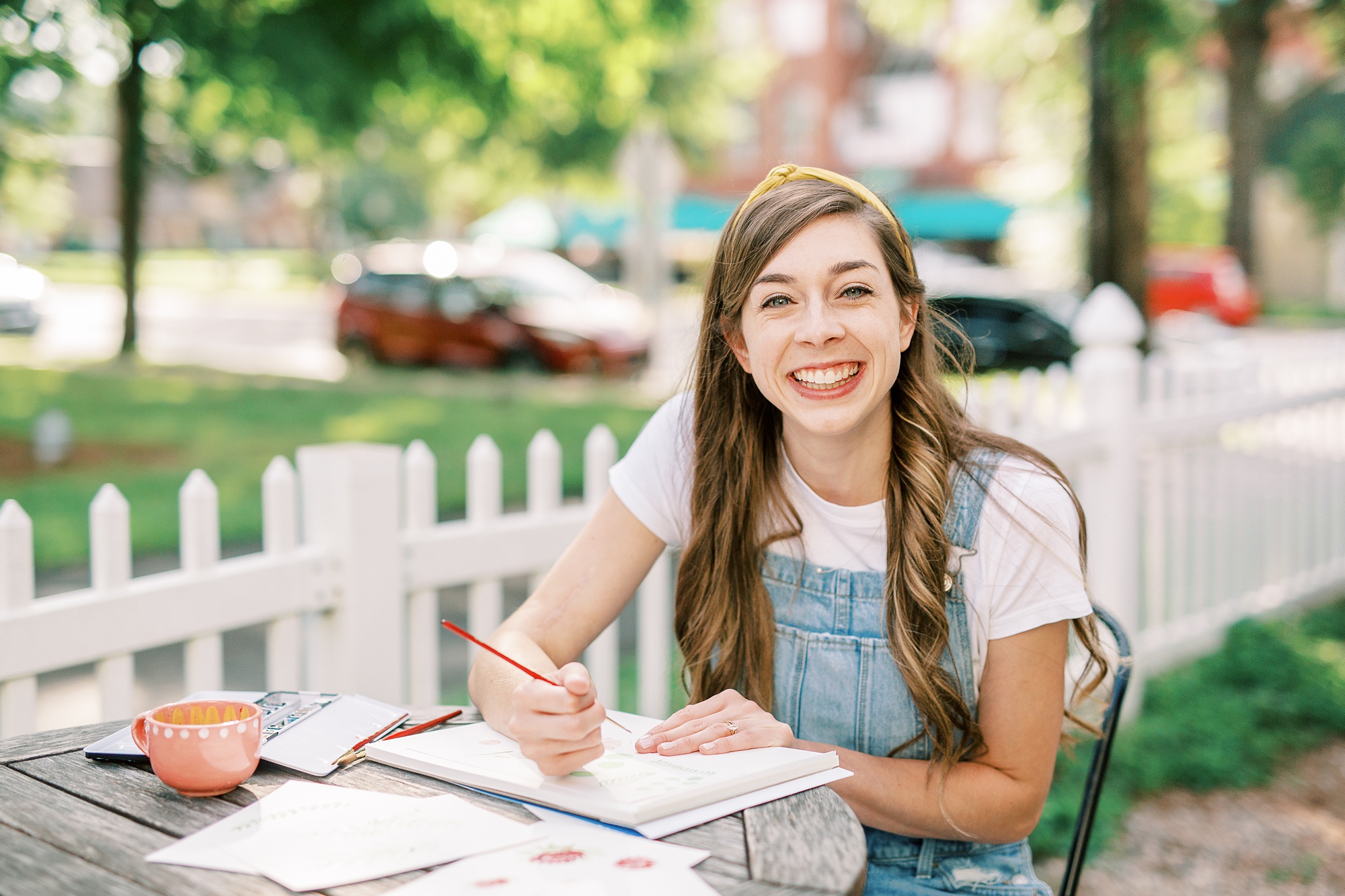 artist smiles during branding photos in Charlotte NC