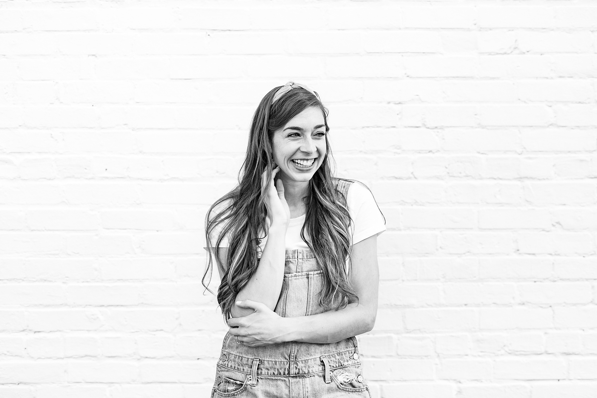 Charlotte artist laughs during branding photos in downtown