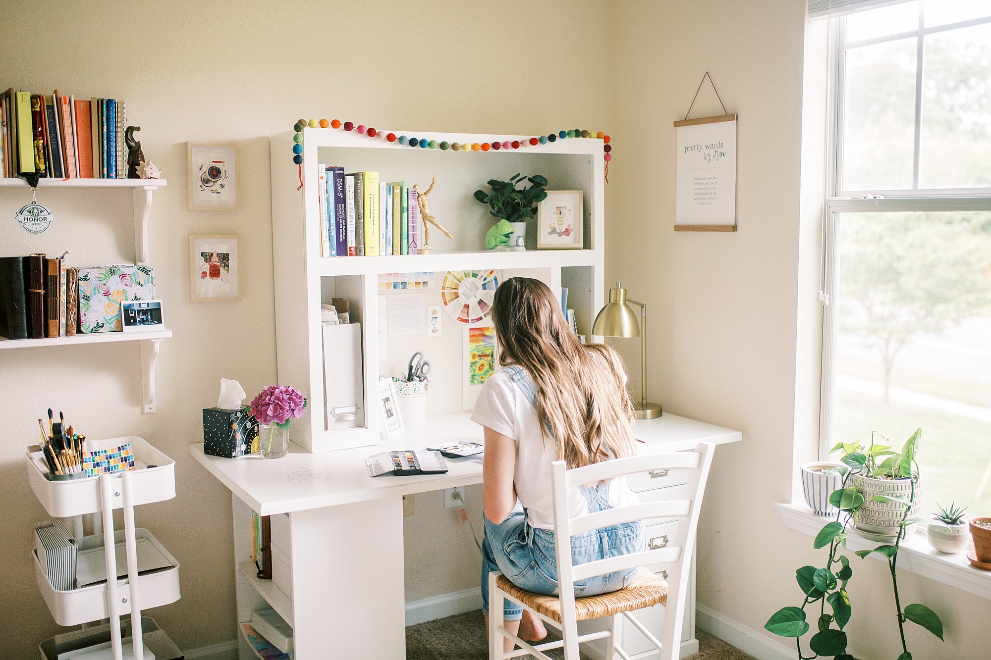 artist works in home office during branding photos