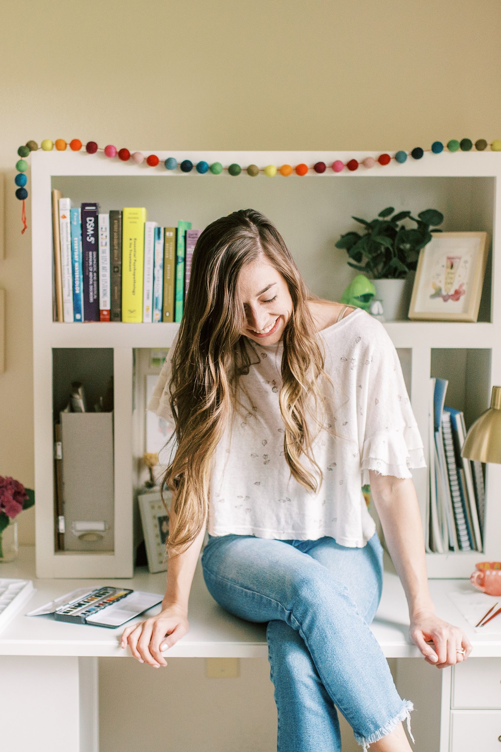 watercolor wedding invitations artist laughs during branding photos at home