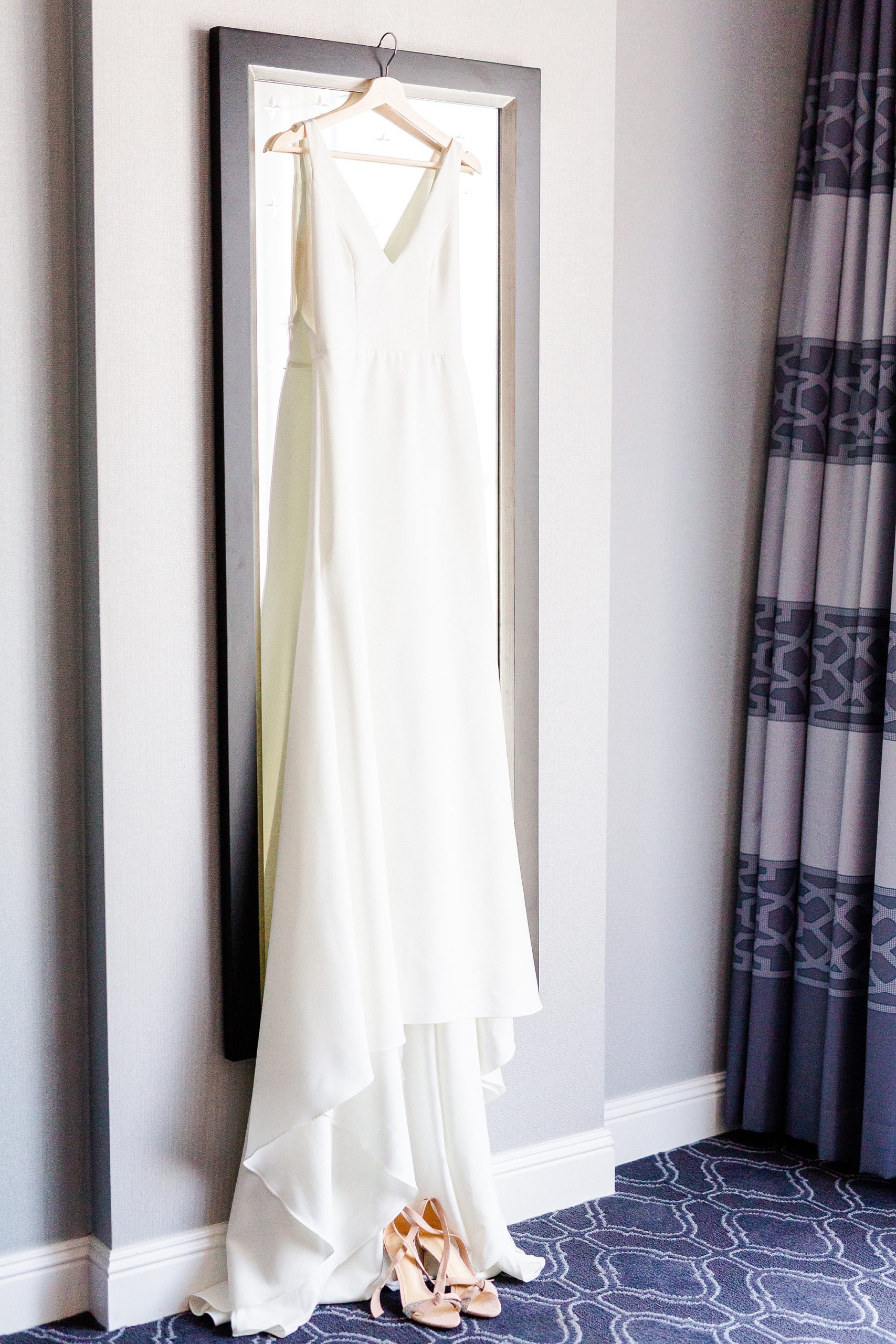 wedding dress hangs in Kimpton Hotel