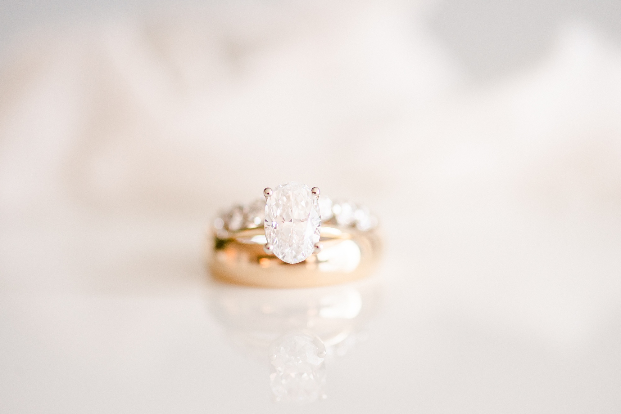 wedding rings stacked before NC wedding