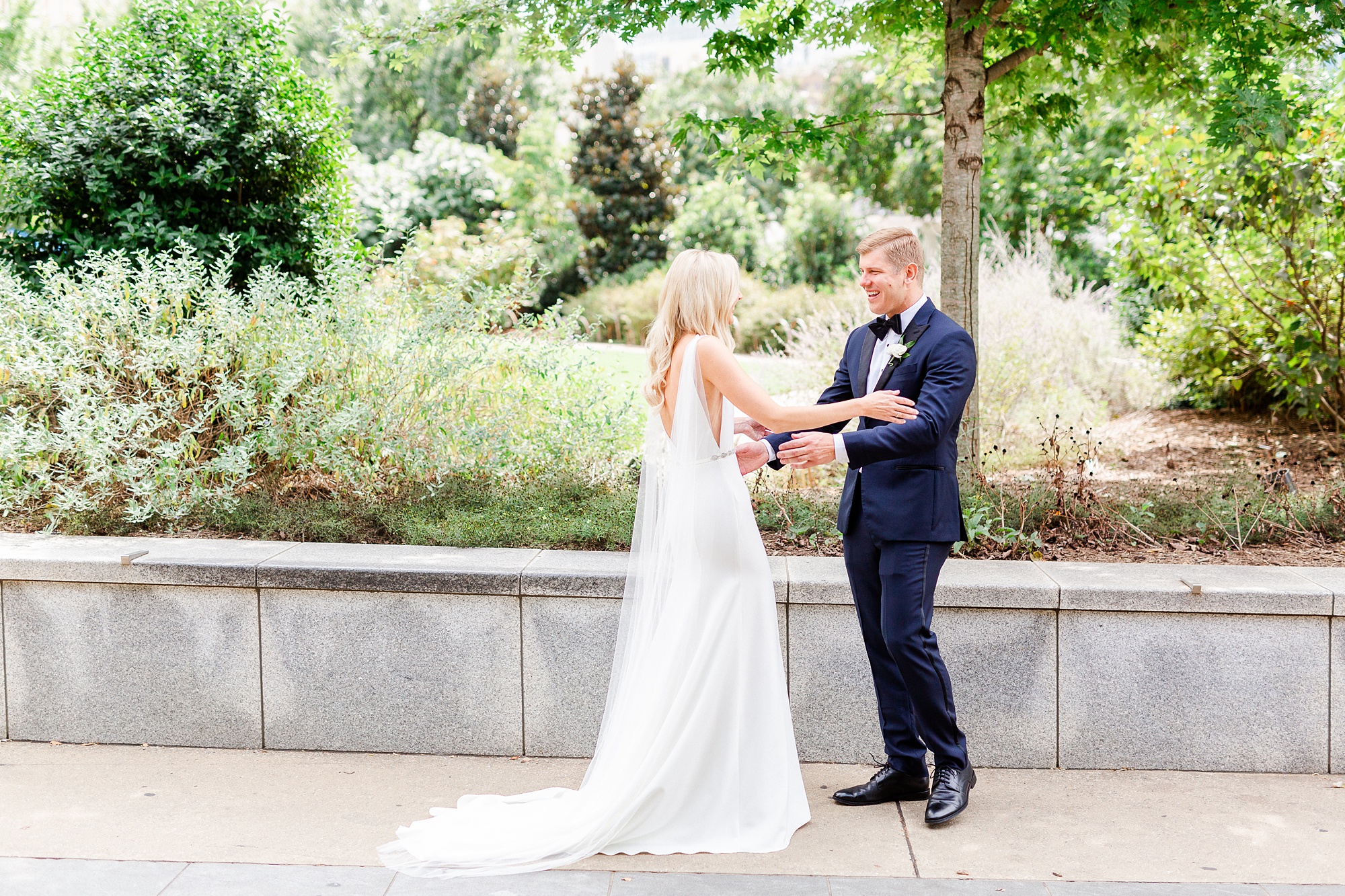groom reacts to seeing bride for the first time during first look at Romare Bearden Park