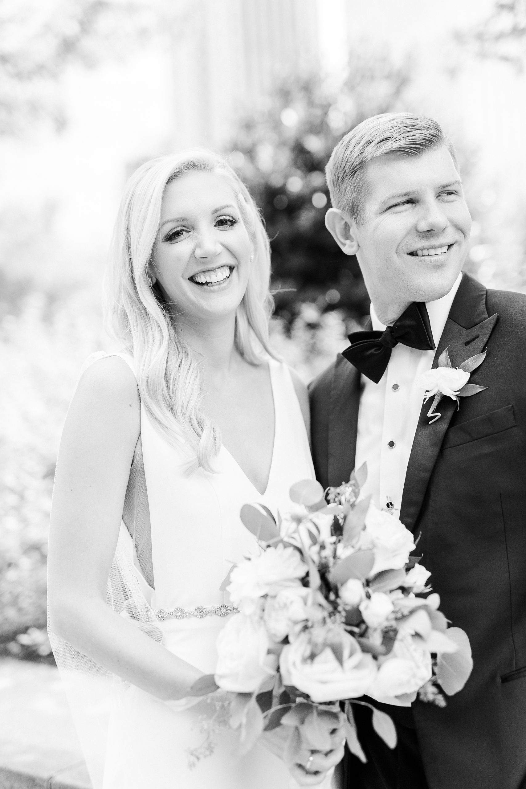 bride laughs with groom during NC wedding photos