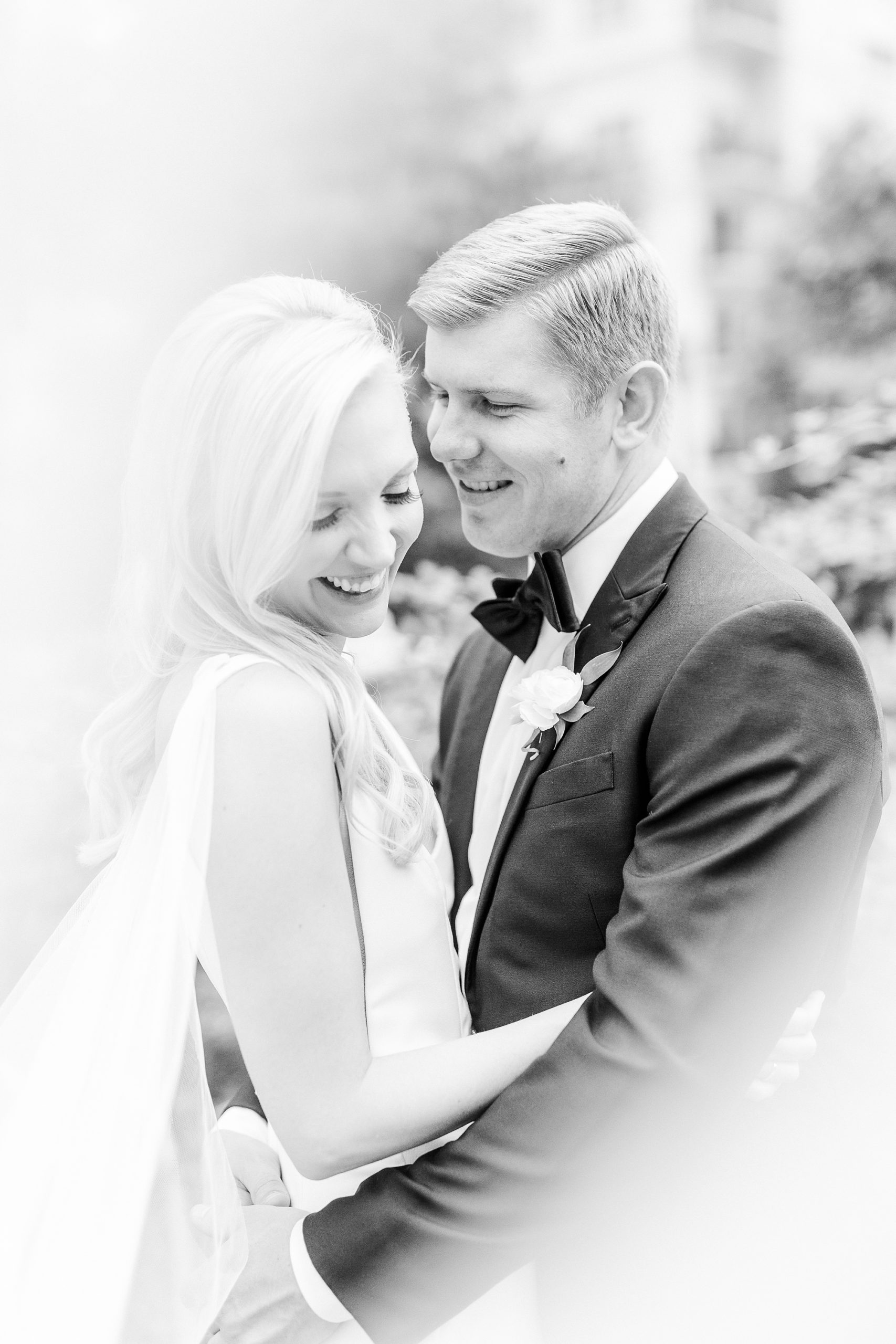 bride and groom hug in Romare Bearden Park